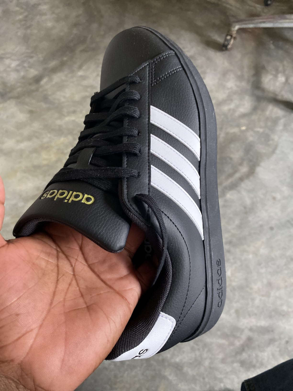 Adidas Grand Court 2.0 in outdoor casual setting showing all-day lifestyle comfort and clean style