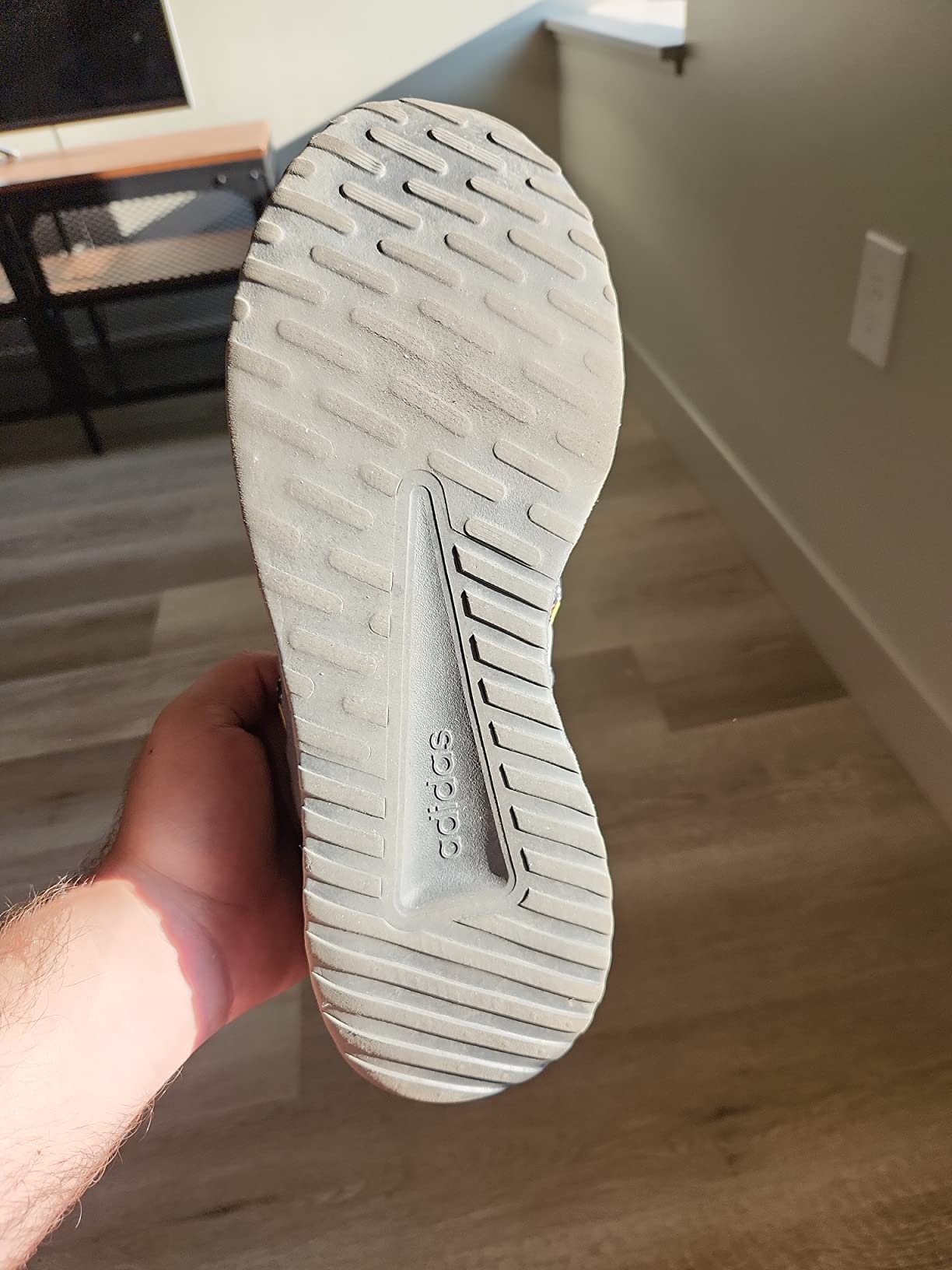 Sole wear pattern on Adidas Lite Racer Adapt 5.0 after one month showing early tread loss at forefoot