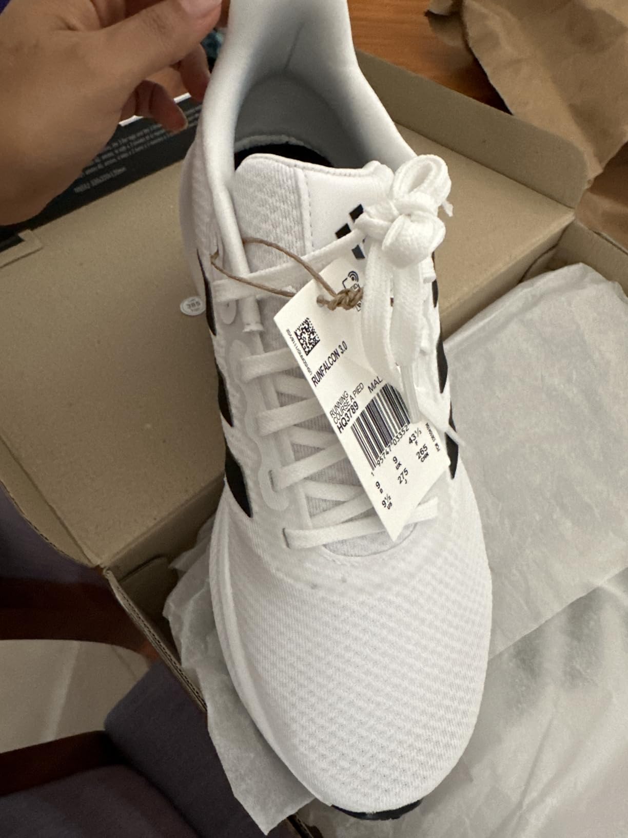 Close-up detail view of Adidas Run Falcon 3.0 textile mesh upper construction with 3-stripes branding