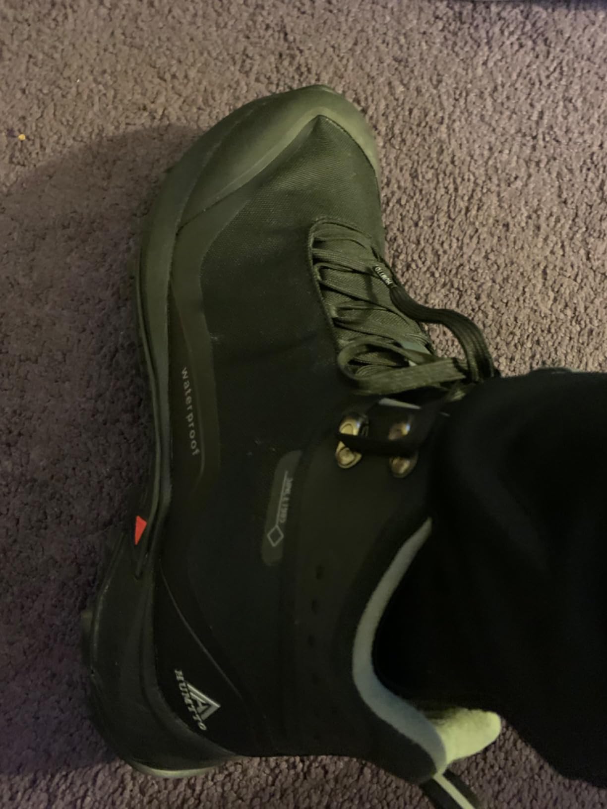 HUMTTO hiking boots shown in work environment use for landscaping and construction applications