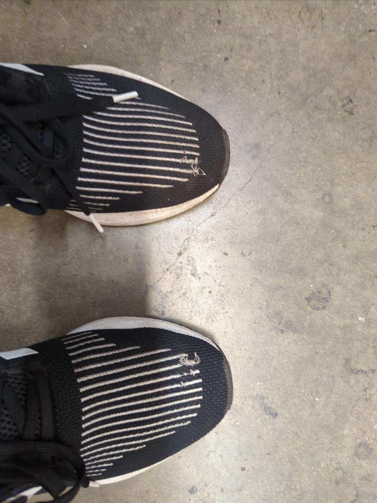 Adidas Swift Run showing lace eyelet that has completely pulled out from the knit upper after four weeks of wear