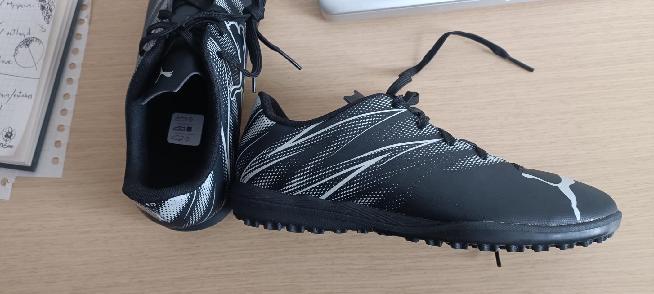 PUMA Attacanto side view showing sleek low-profile design and lace-up closure