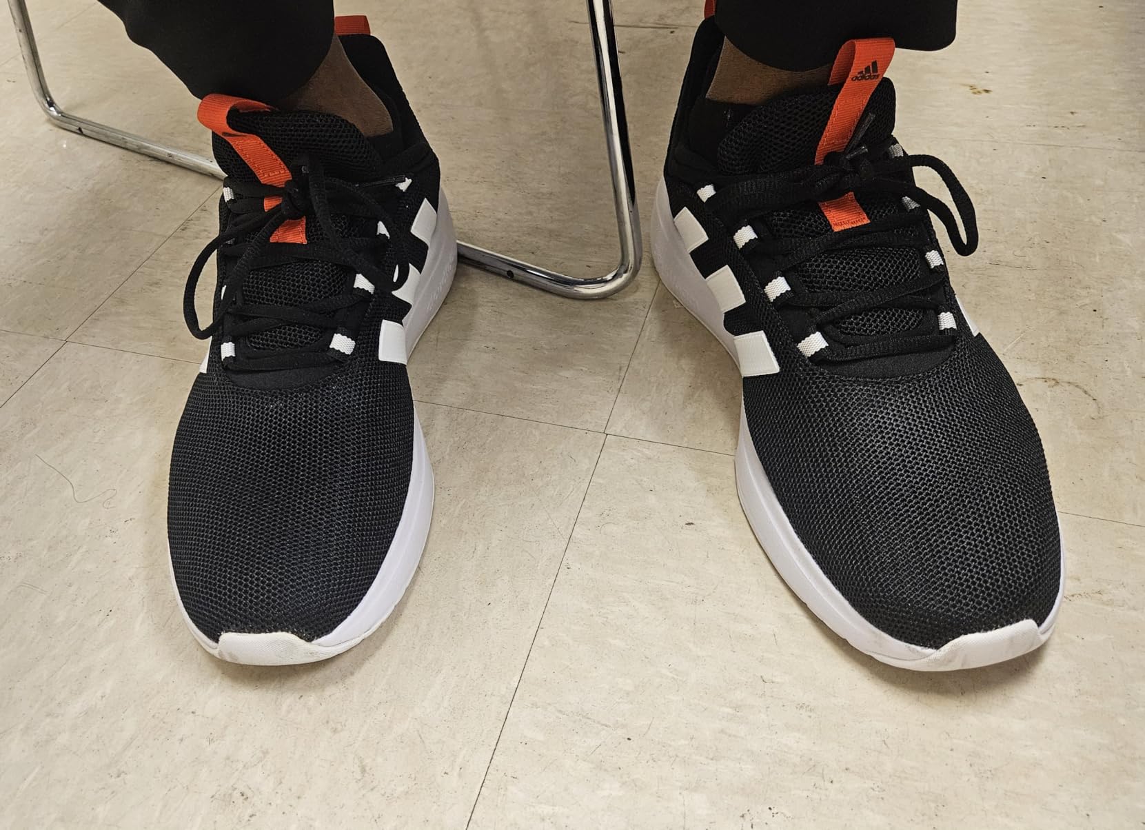 Close-up of Adidas Racer TR23 mesh upper showing engineered mesh construction and three stripes detail