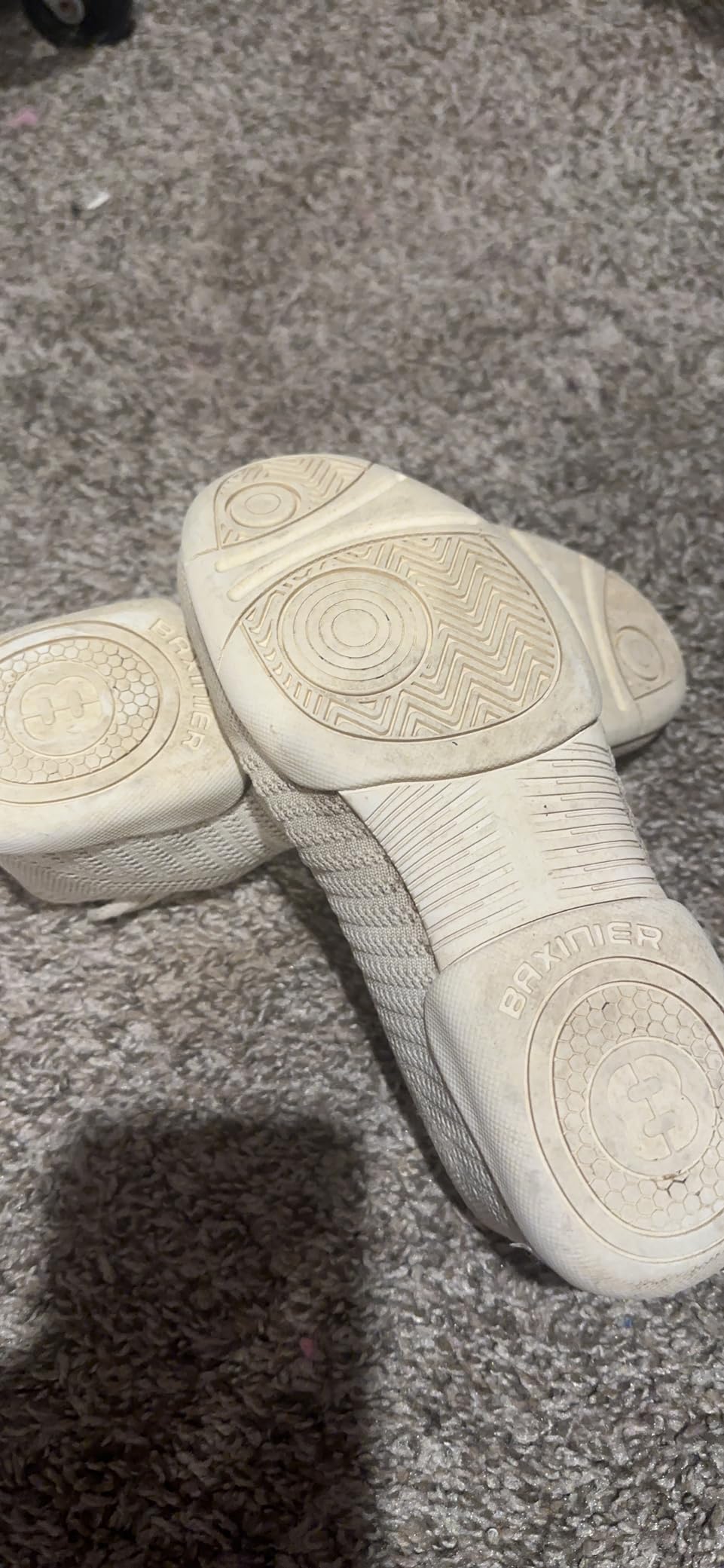 Detailed comparison showing BAXINIER marketing features versus actual performance testing results