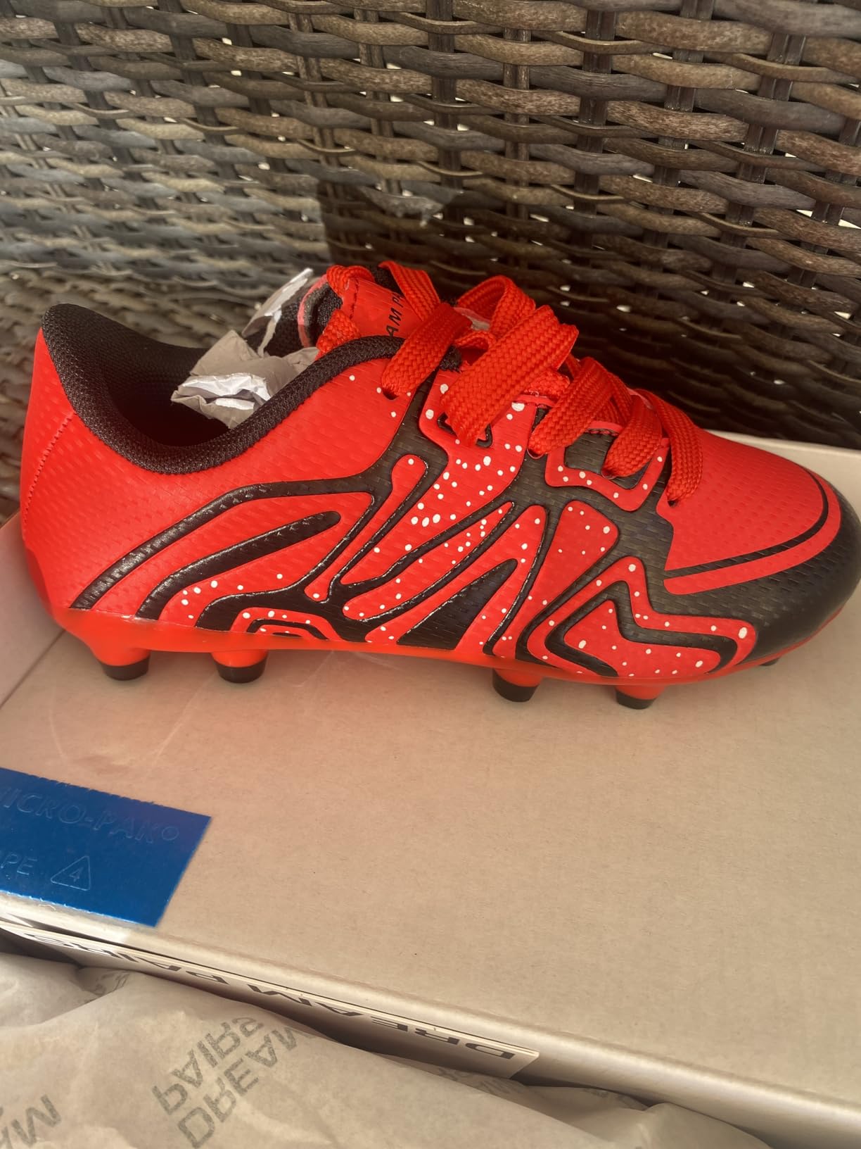 Close-up detail shot of molded stud configuration on DREAM PAIRS cleat sole