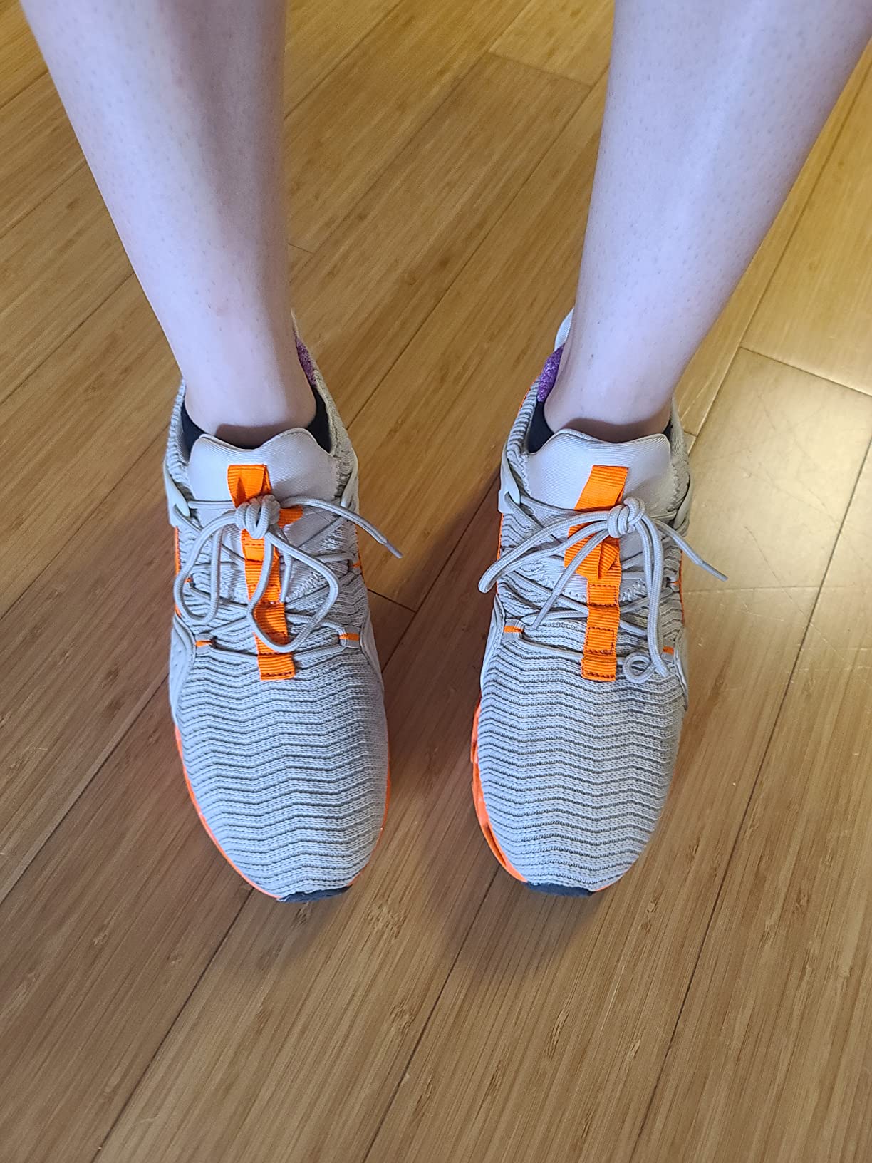 Side profile view of Ezkrwxn sneakers showing mesh construction and slip-on entry