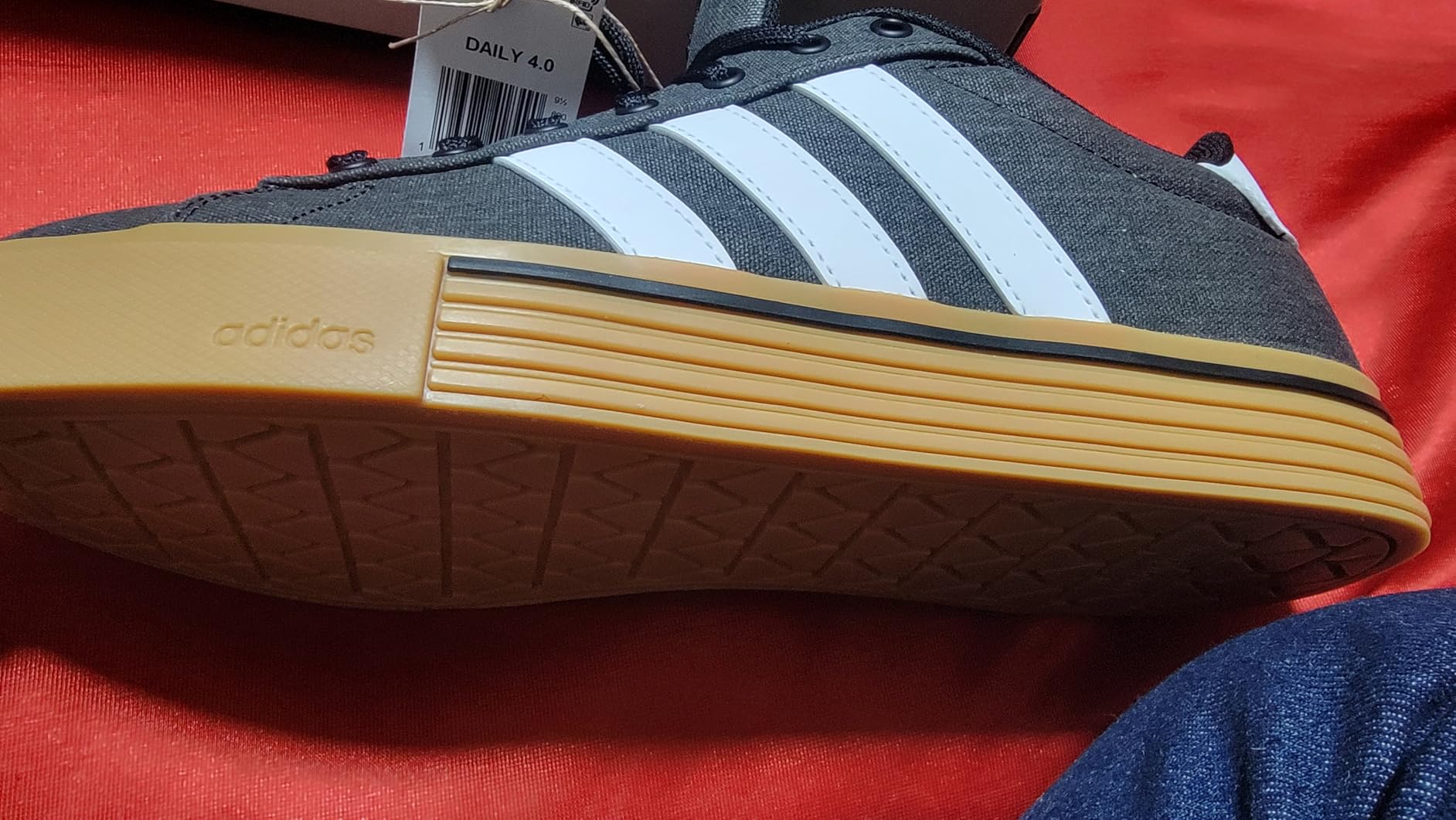 Bottom sole view of Adidas Daily 4.0 showing rubber outsole tread pattern detail
