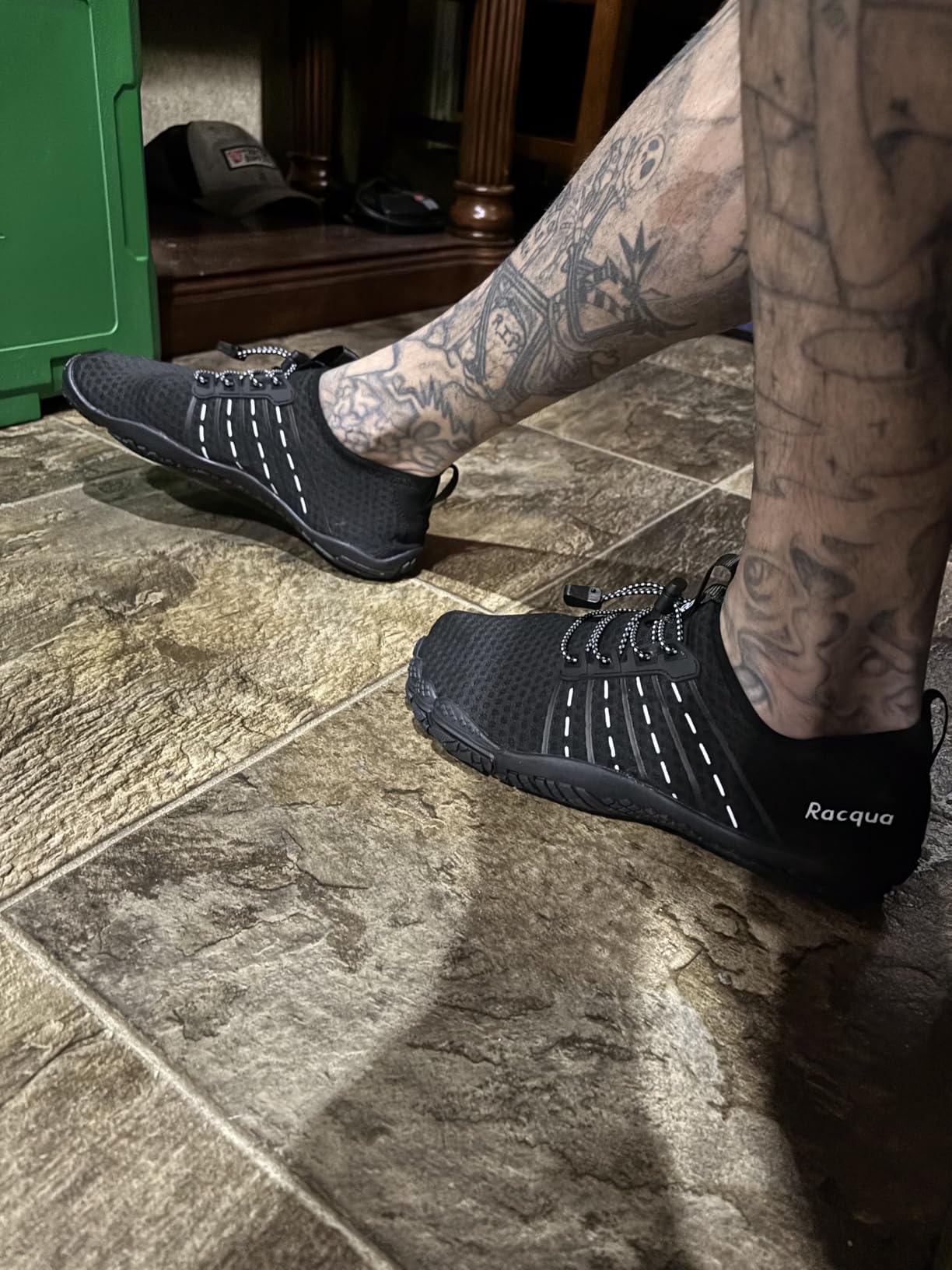 Close-up of Racqua water shoes showing adjustable elastic closure system and drainage-focused sole design