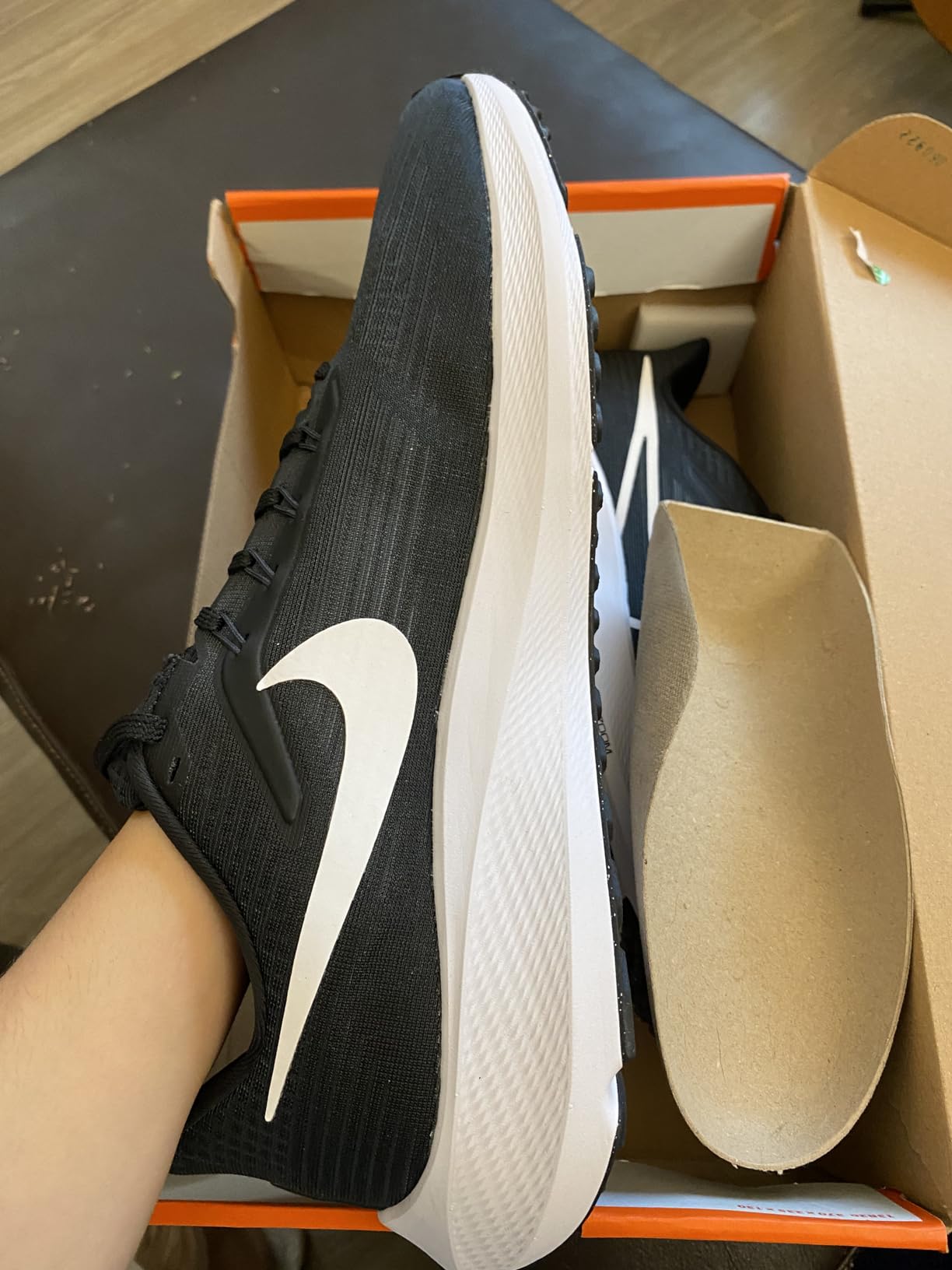 Close-up of Nike Pegasus 39 engineered mesh upper showing Flywire cable integration at midfoot