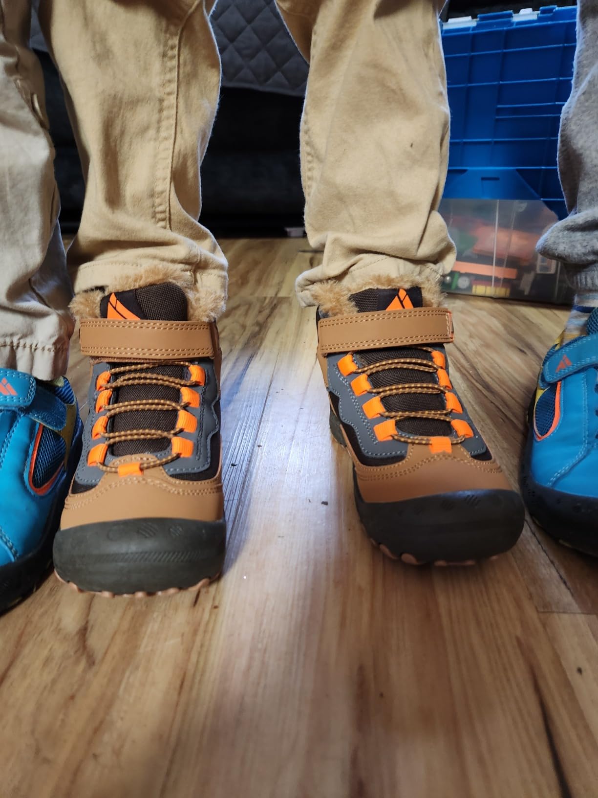 Child wearing Mishansha hiking boots on rocky trail showing real-world traction and outdoor performance