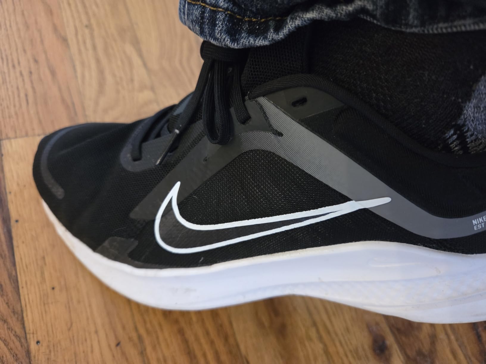 Nike Men's Quest 5 construction detail showing mesh breathability and upper integrity after testing