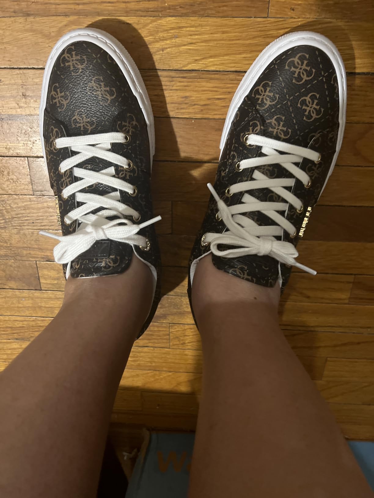 GUESS Women's Loven Sneaker showing multiple available color options and style versatility