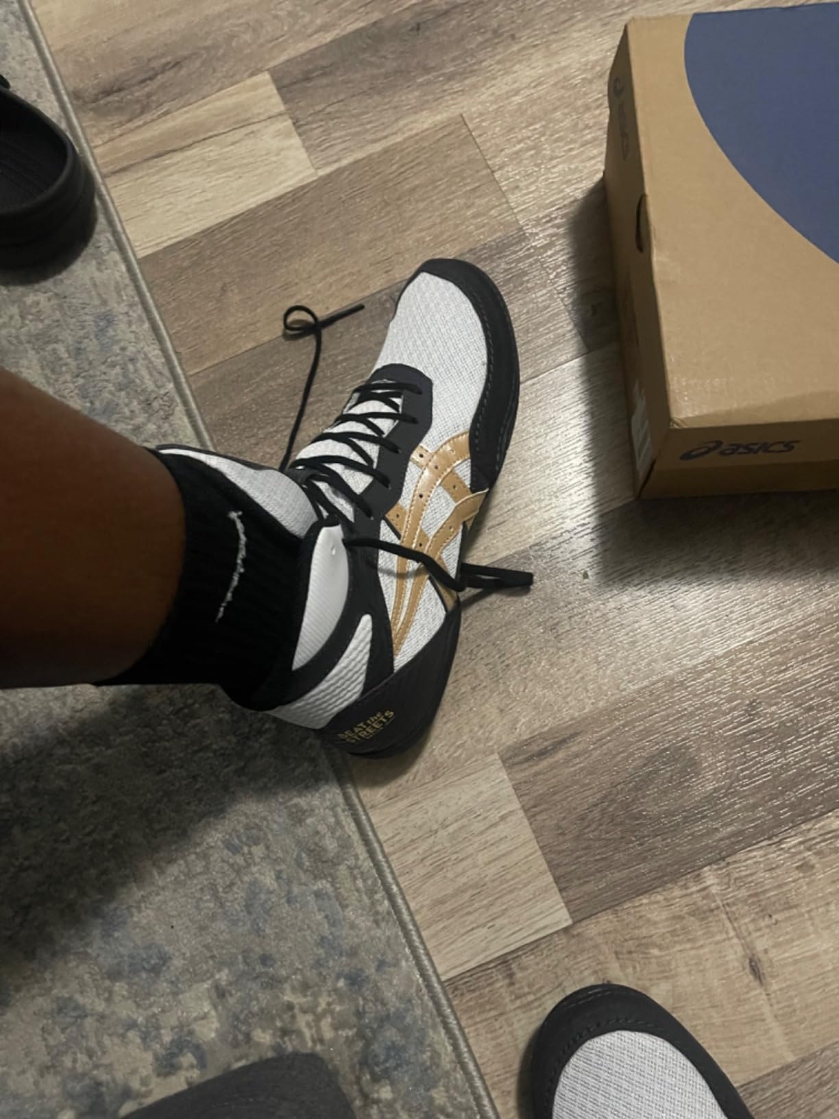 ASICS Matflex 7 wrestling shoes in action during wrestling practice showing mat grip and lightweight performance