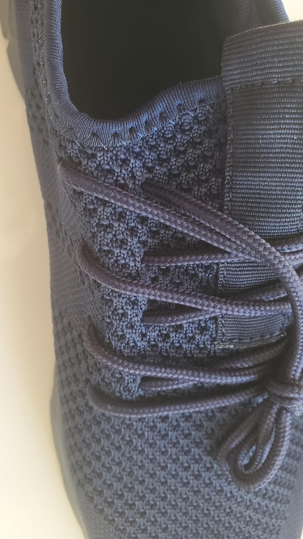 Top-down view of YITUHIO shoe showing lace construction and elastic collar fit