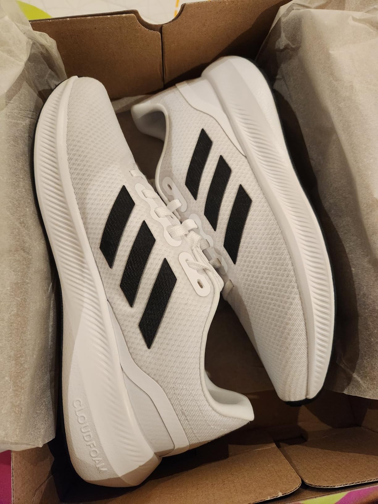 Adidas Run Falcon 3.0 product presentation showing packaging and overall shoe design