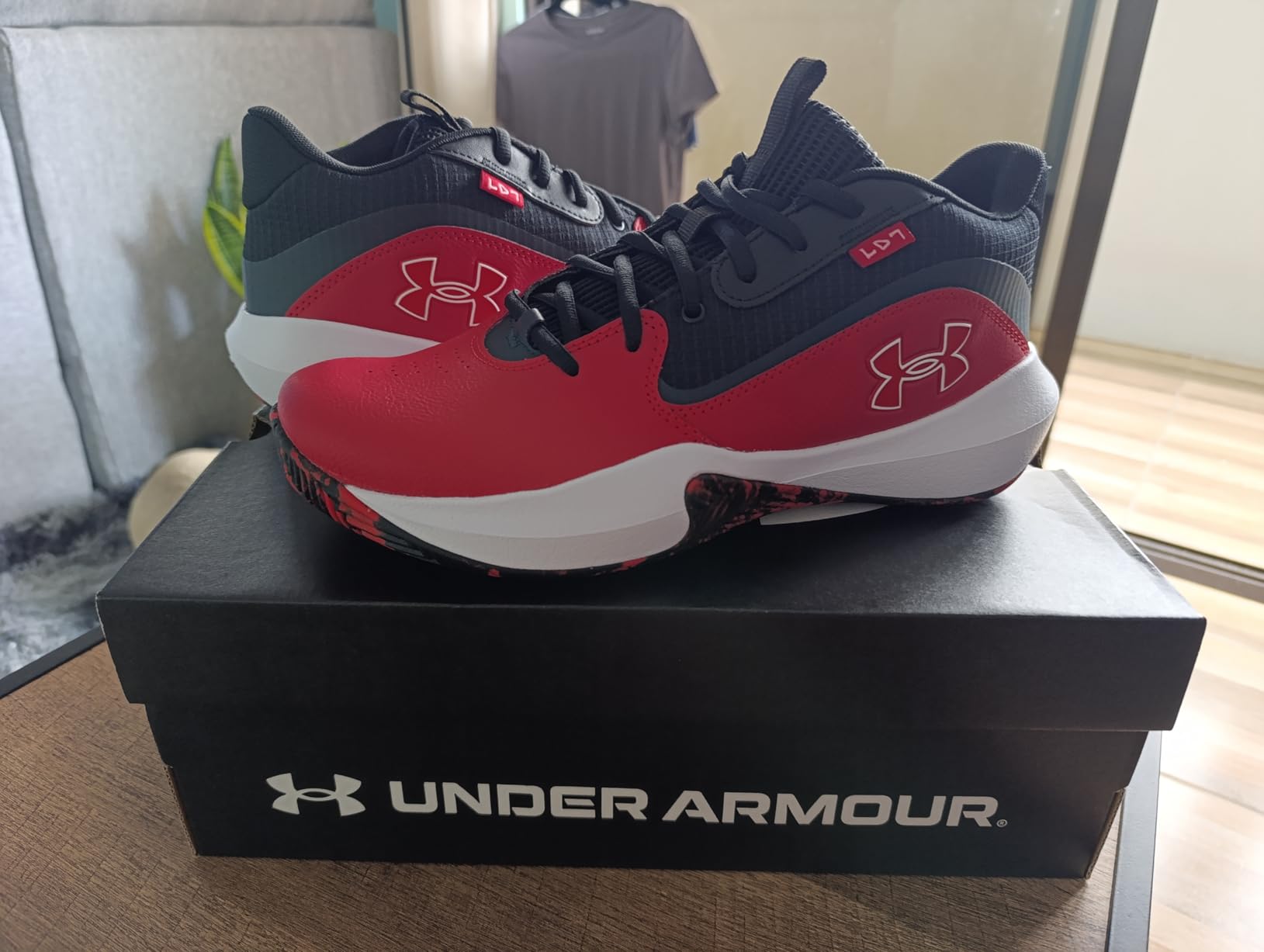 Under Armour Lockdown 7 side profile showing breathable mesh upper with leather film overlays and rubber outsole