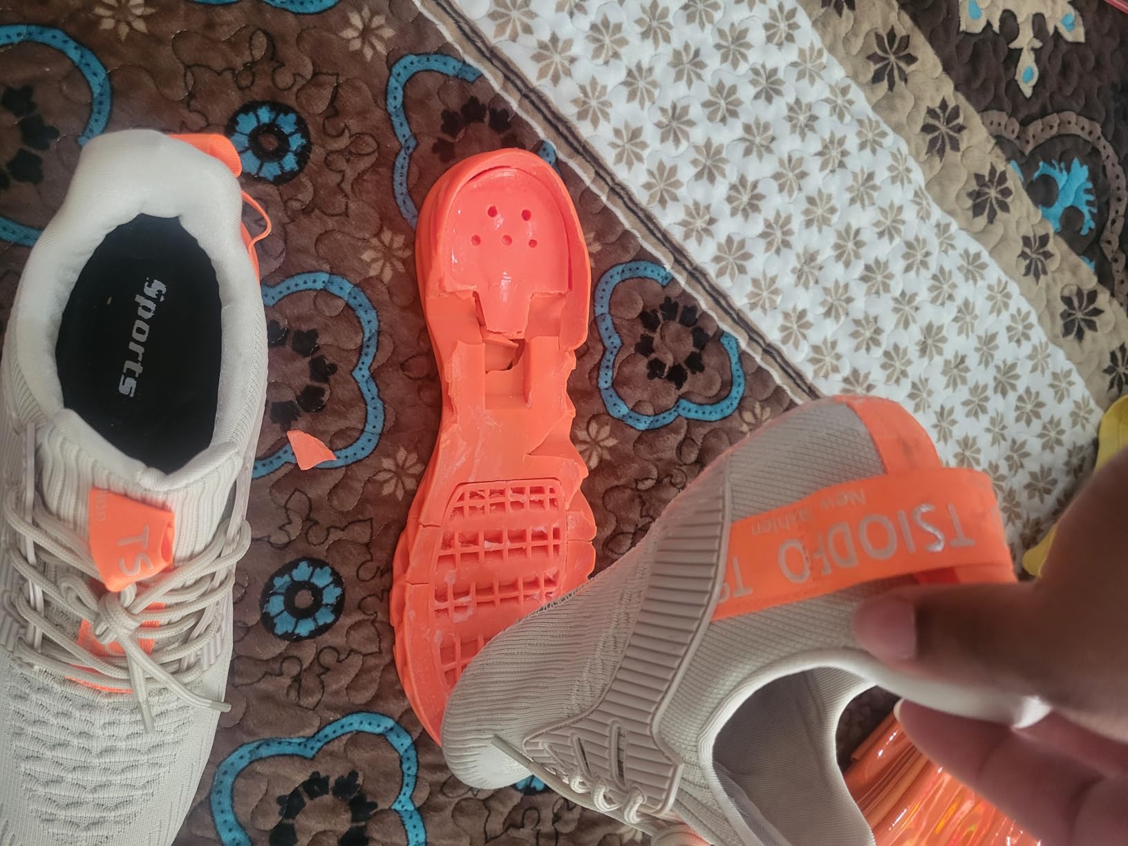Close-up of TSIODFO sole construction showing rubber tread pattern and outsole design