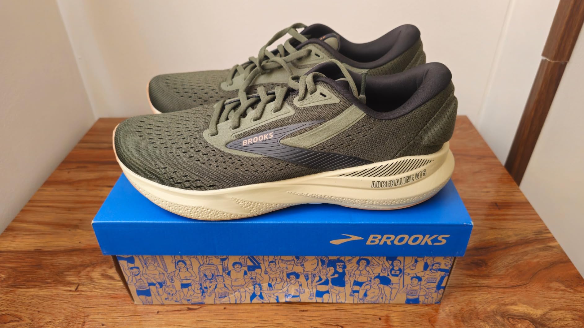 Brooks Men's Adrenaline GTS 24 running shoe in blue and orange colorway showing GuideRails support system