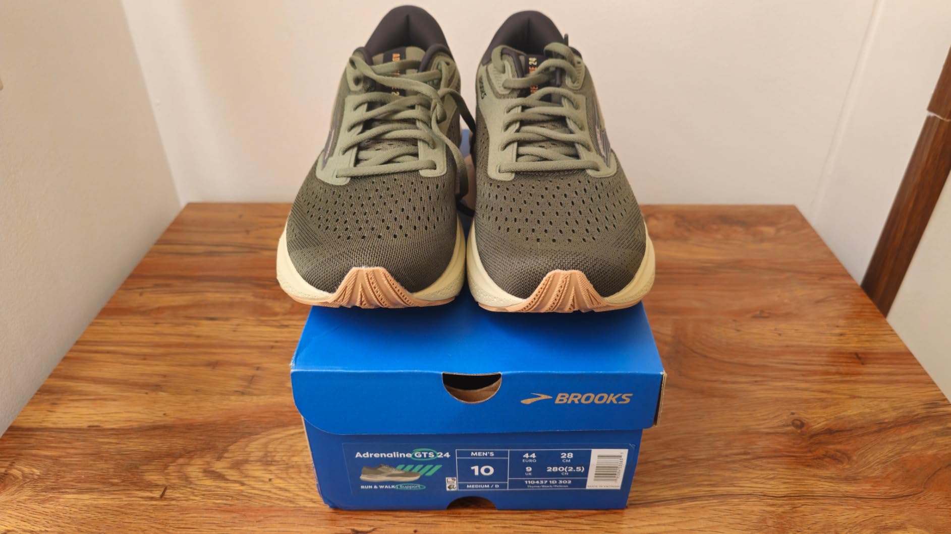Close-up detail of Brooks Adrenaline GTS 24 upper mesh showing engineered breathability and structured support zones