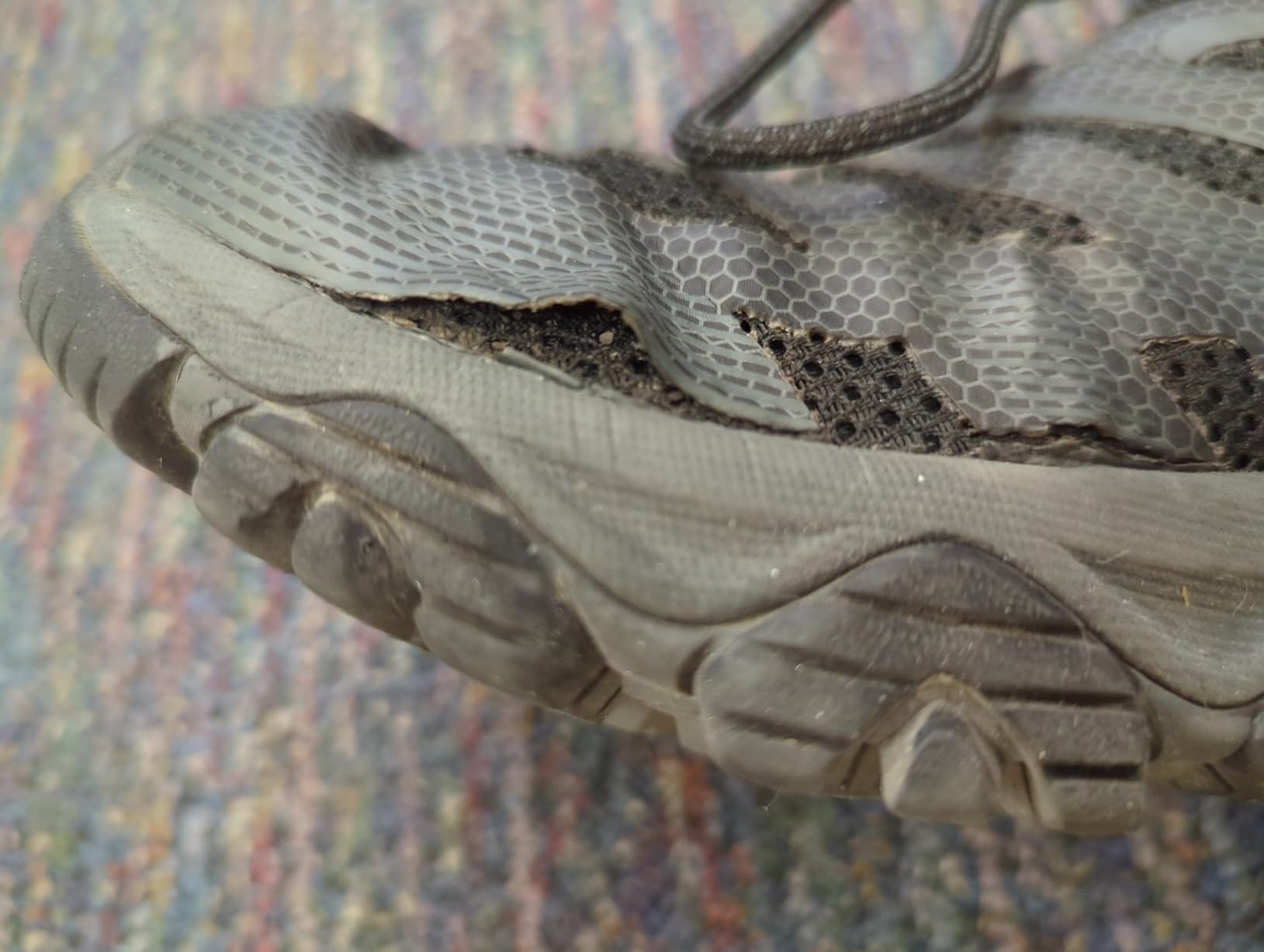 Close-up of TPU coating separation from mesh on Merrell Moab 3 Edge