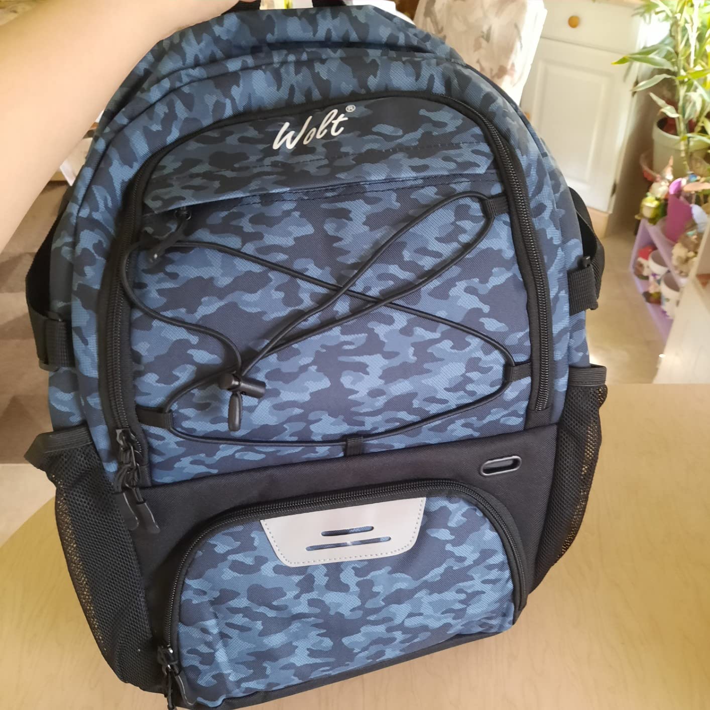 WOLT Basketball Backpack packed full showing realistic storage capacity with ball, shoes, and gear loaded
