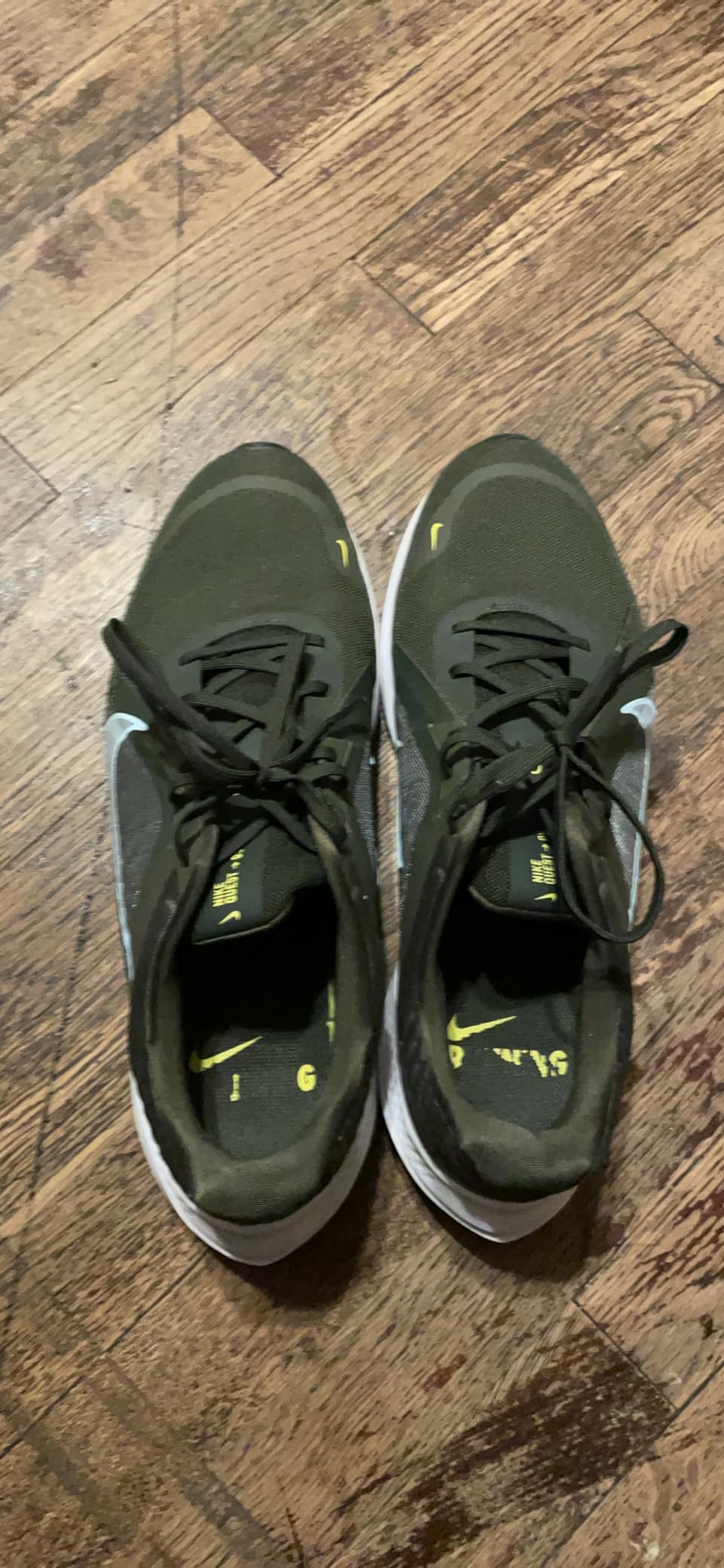 Nike Men's Quest 5 black grey colorway showing mesh upper and midfoot fitband system