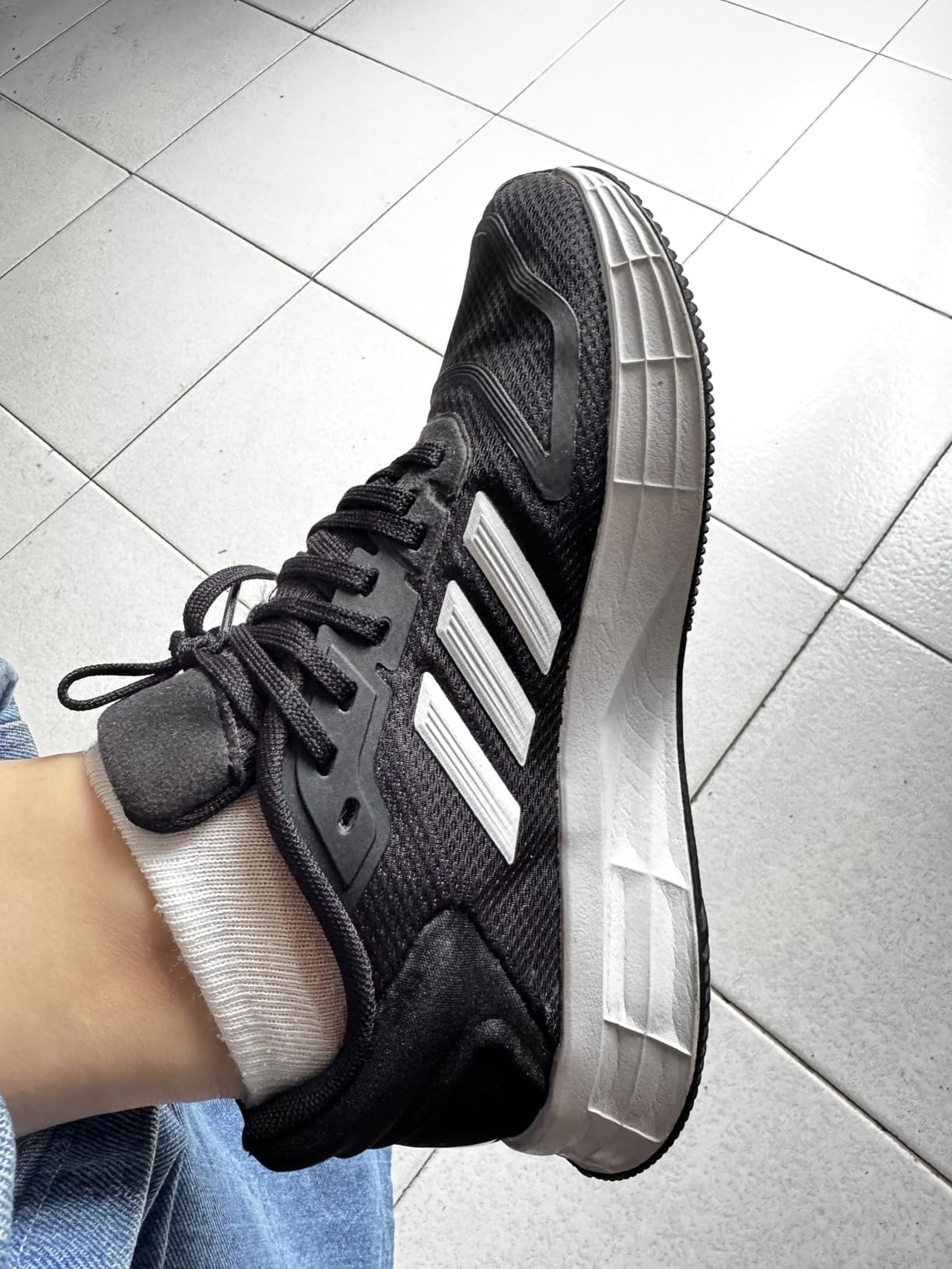 Side profile view of Adidas Duramo SL 2.0 showing LIGHTMOTION midsole construction and rubber outsole traction pattern