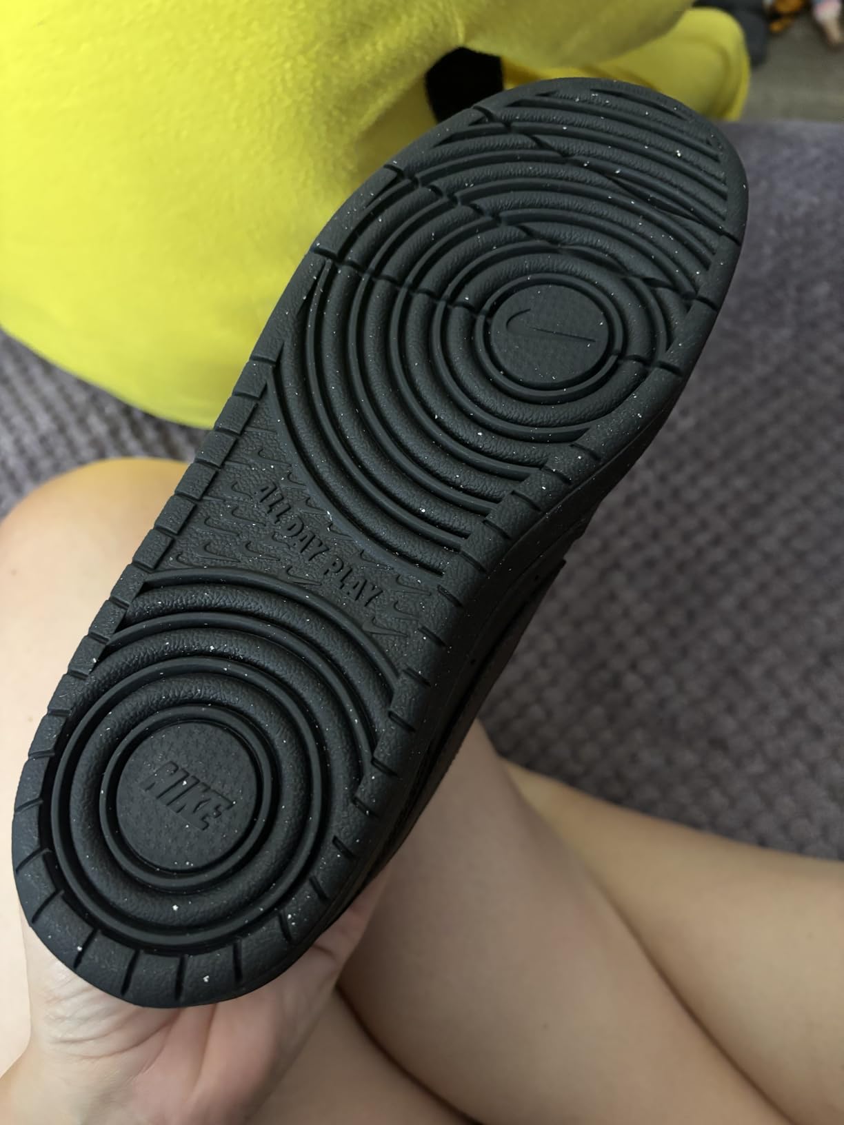 Side profile of Nike Court Borough Low showing synthetic upper construction and cupsole outsole design