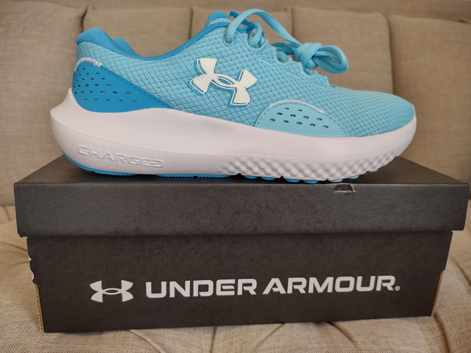 Under Armour Women's Charged Surge 4 multiple colorways including black white pink showing versatile daily wear options