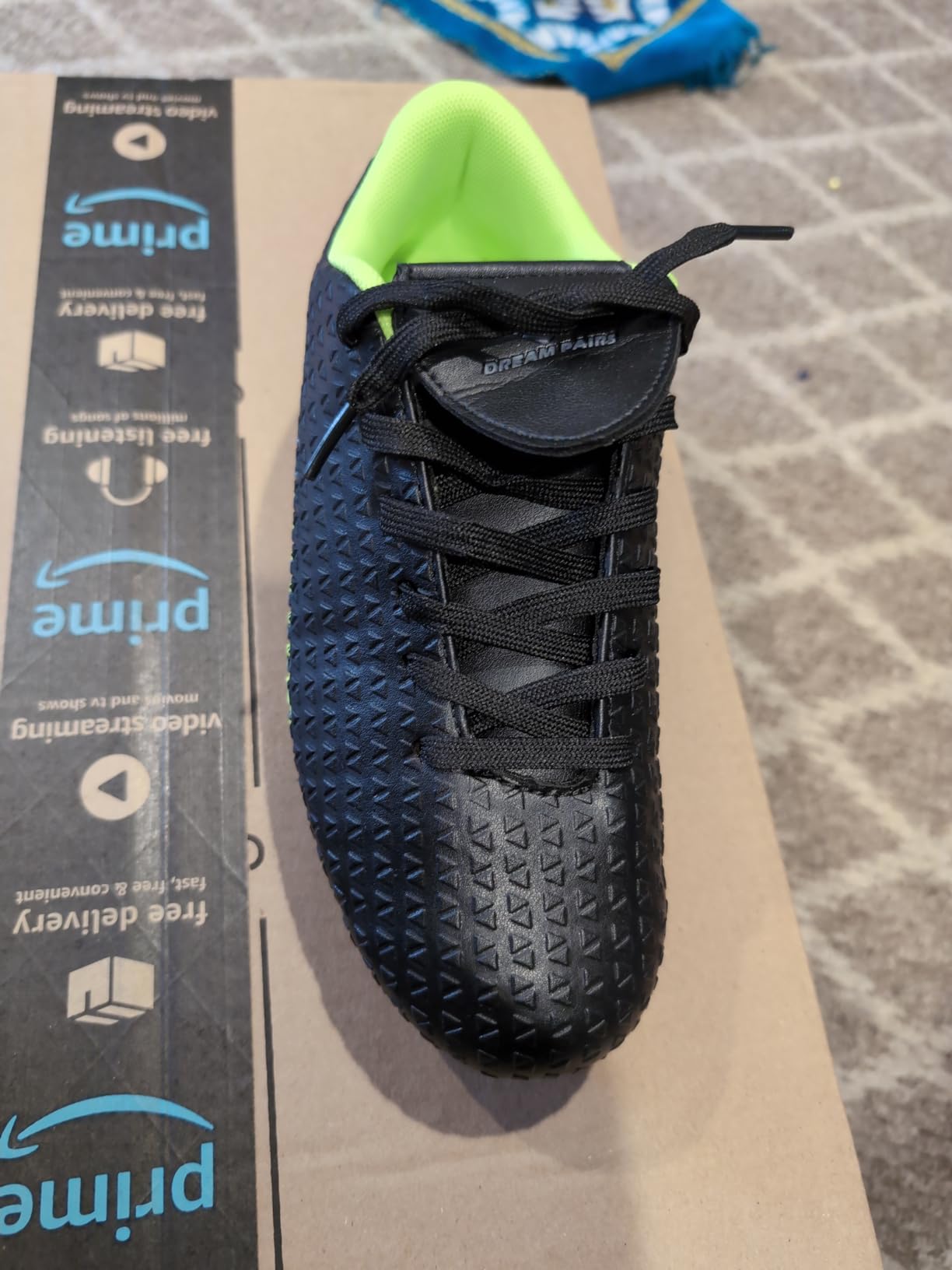 DREAM PAIRS boys girls soccer cleats neon green black colorway showing fold-over tongue design and high ankle appearance