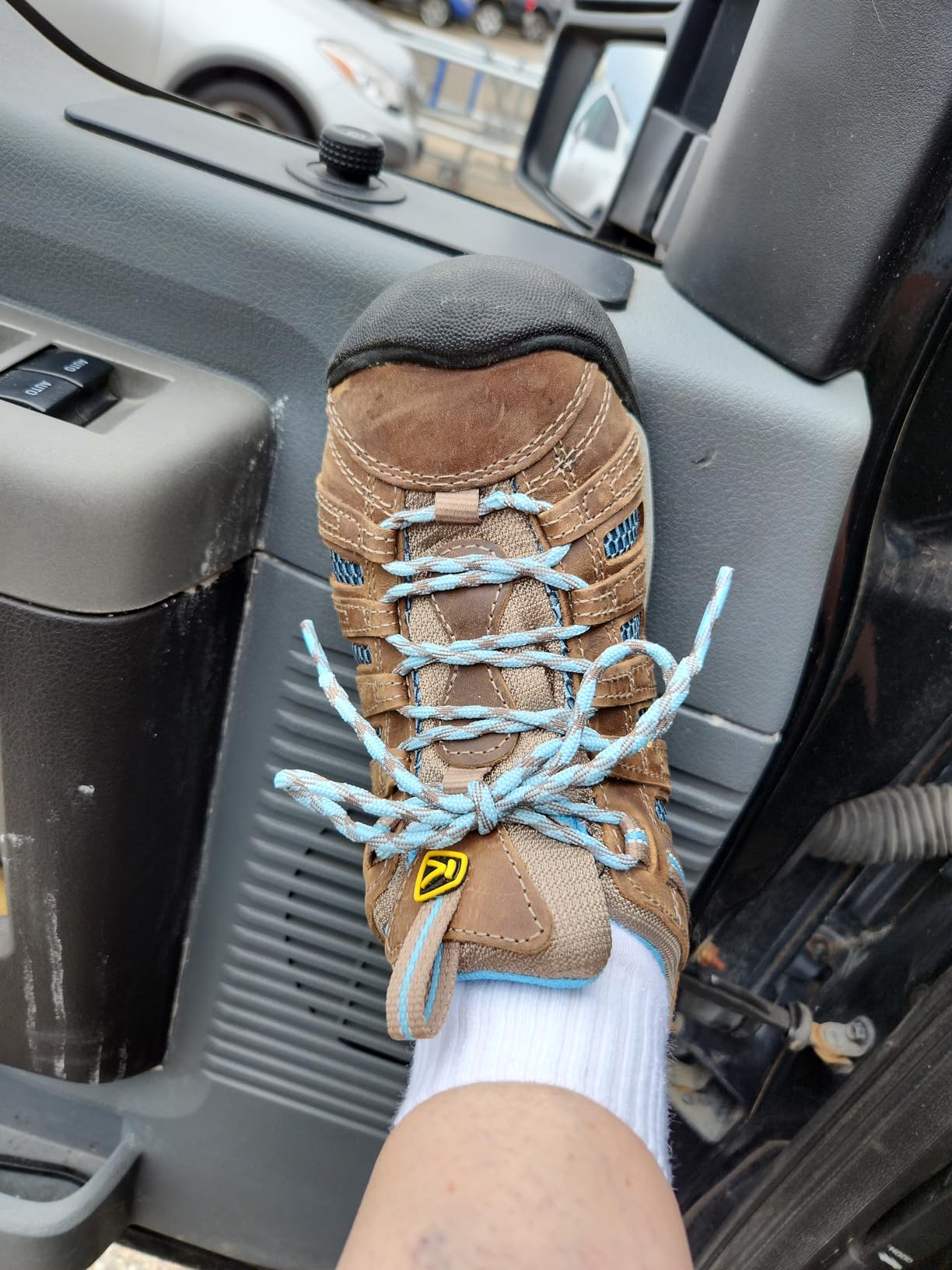 KEEN Voyageur comparison showing distinctive wide toe box design versus standard hiking shoe profile