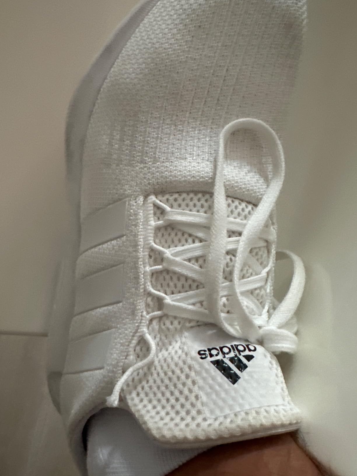 Multiple angles of the Adidas Swift Run showing colorway variations and overall design from different perspectives