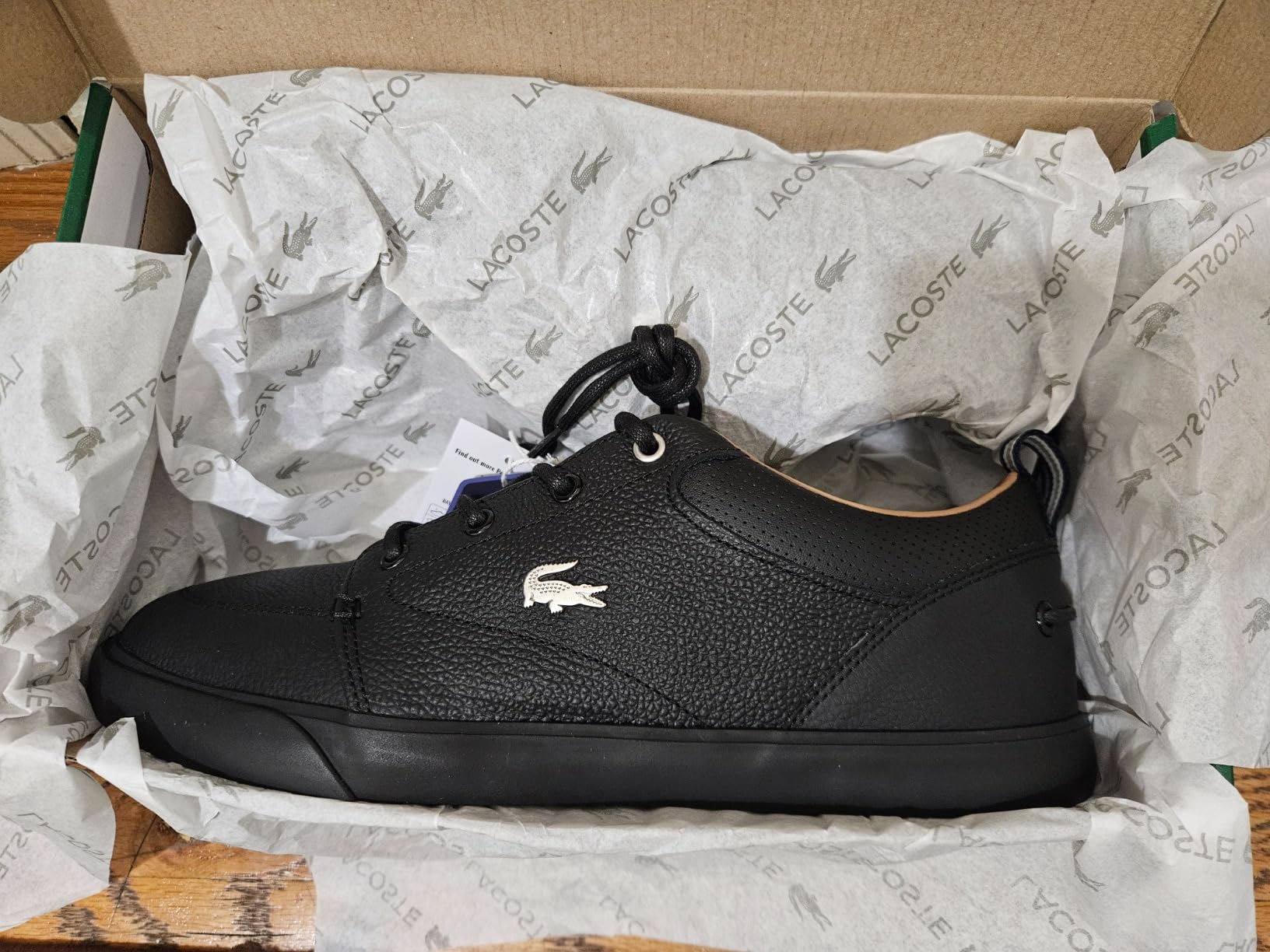 Lacoste Men's Bayliss Sneaker in Deep White colorway showing premium leather upper with iconic crocodile logo and clean aesthetic