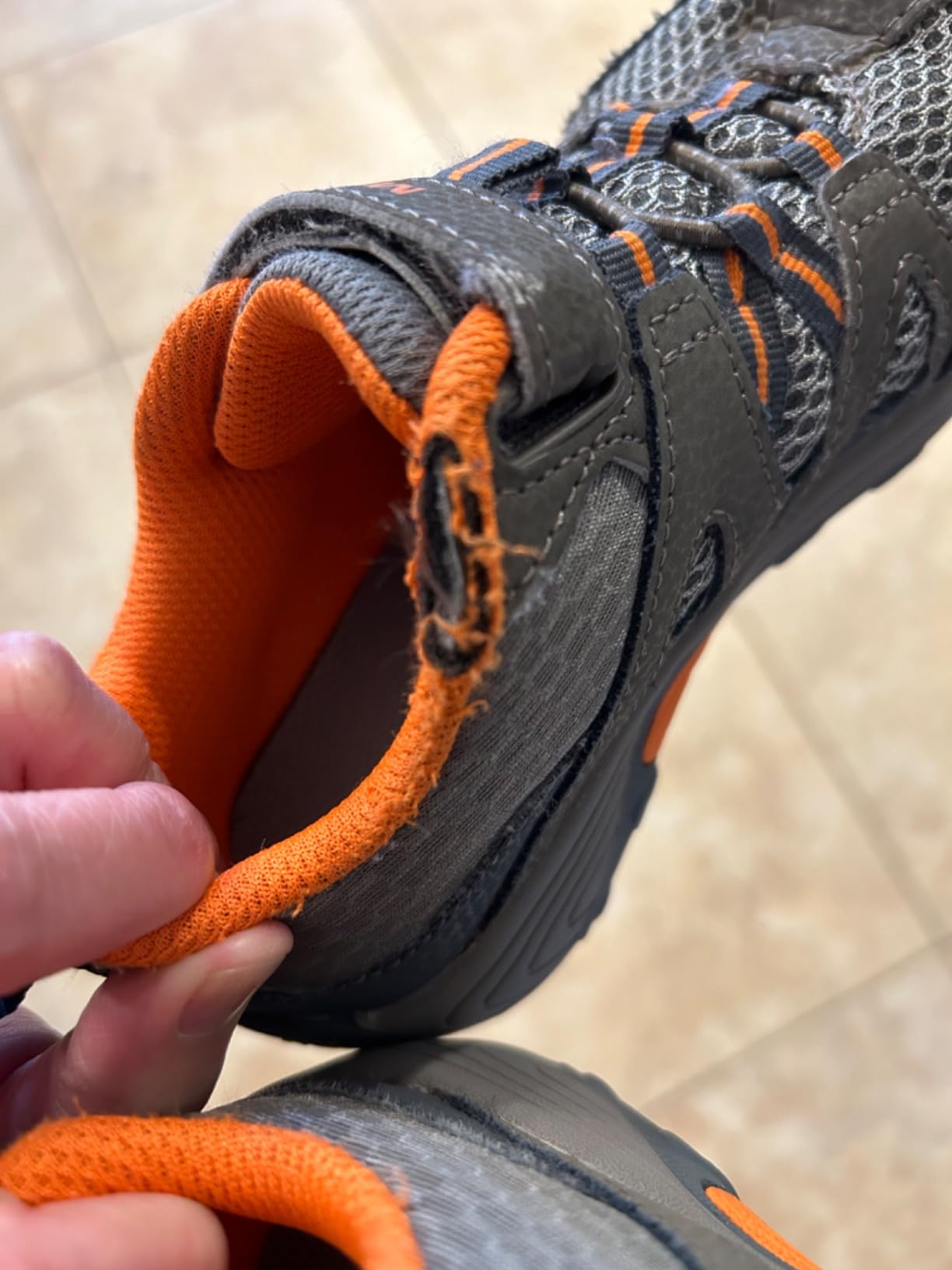 Fabric fraying visible along interior liner of Merrell Trail Chaser after one month of school wear