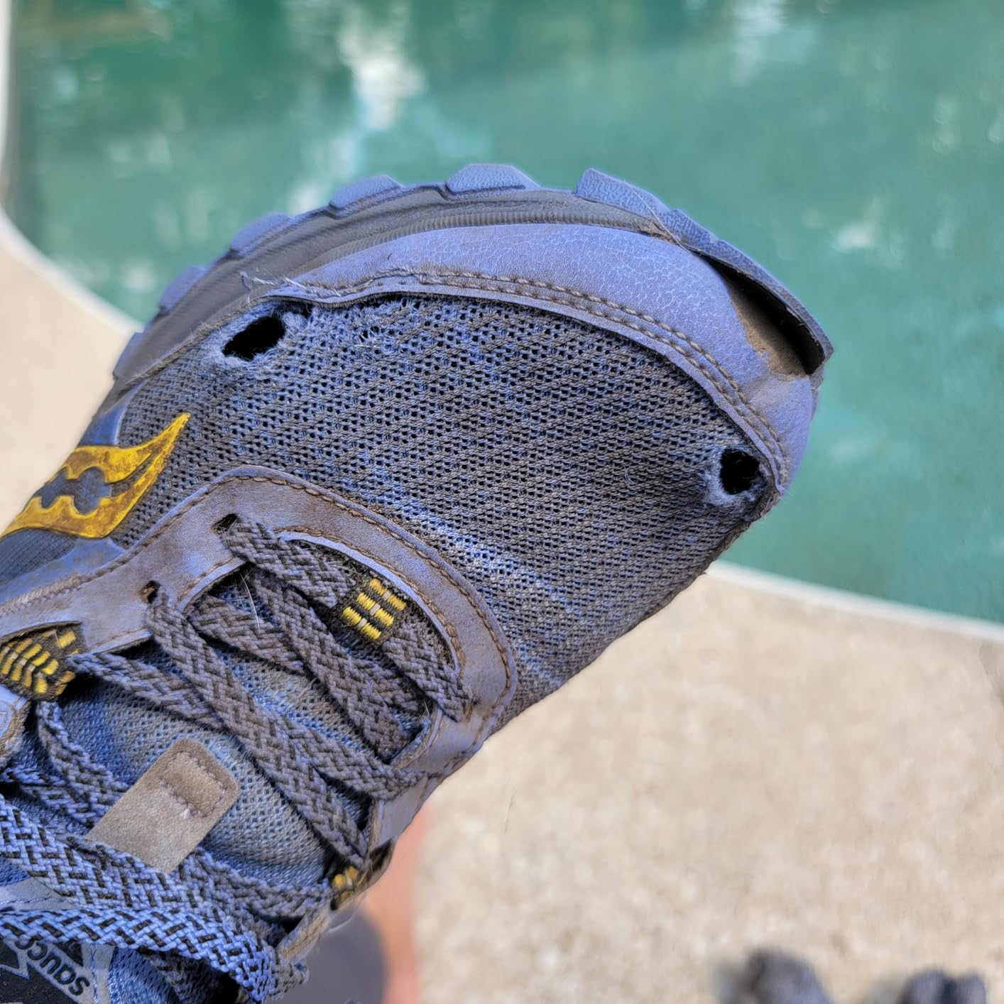 Close-up of Saucony Excursion TR16 mesh wear showing durability issues at big toe pressure point after extended use
