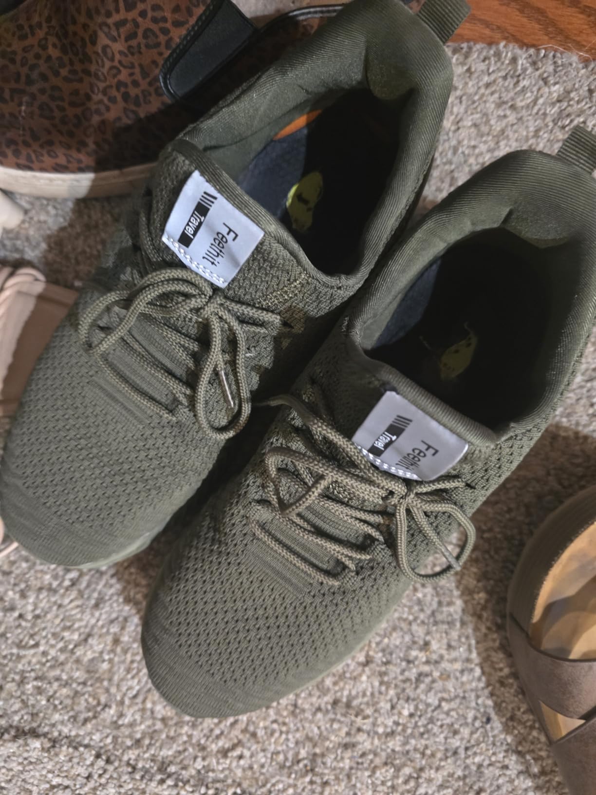 Multiple Feethit colorways showing available style options including olive, navy, and black