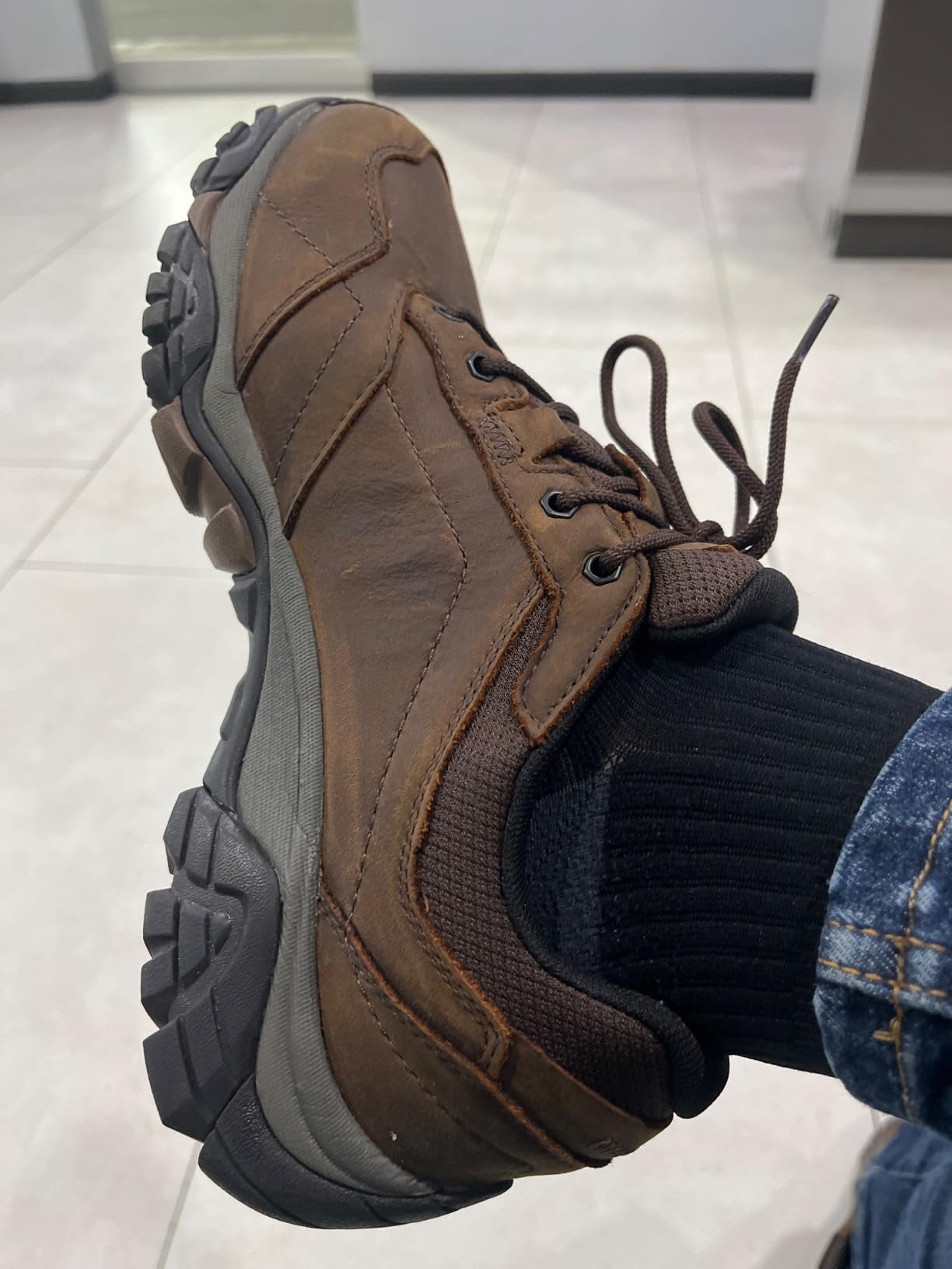 Merrell Moab Adventure Lace waterproof hiking shoe showing nubuck leather upper and Vibram outsole on outdoor terrain