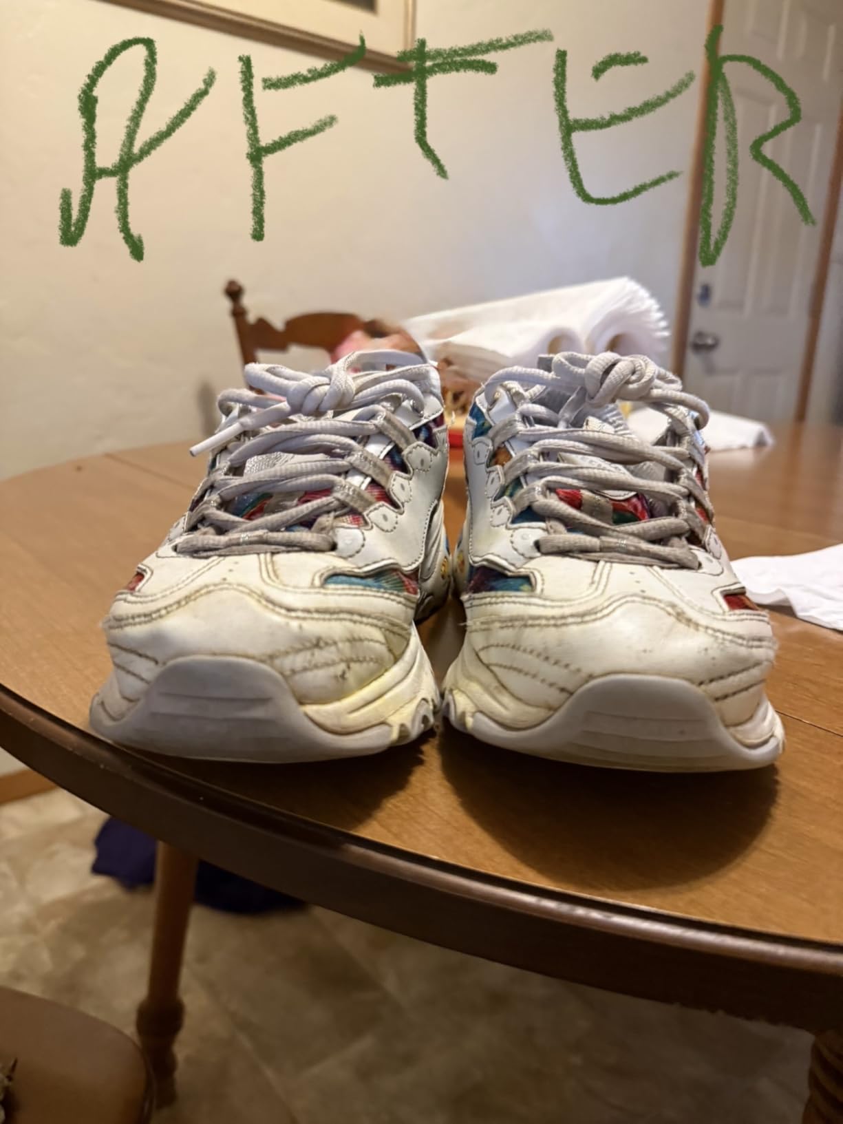 Proper scrubbing technique demonstration showing toothbrush application with foaming cleaner on shoe upper