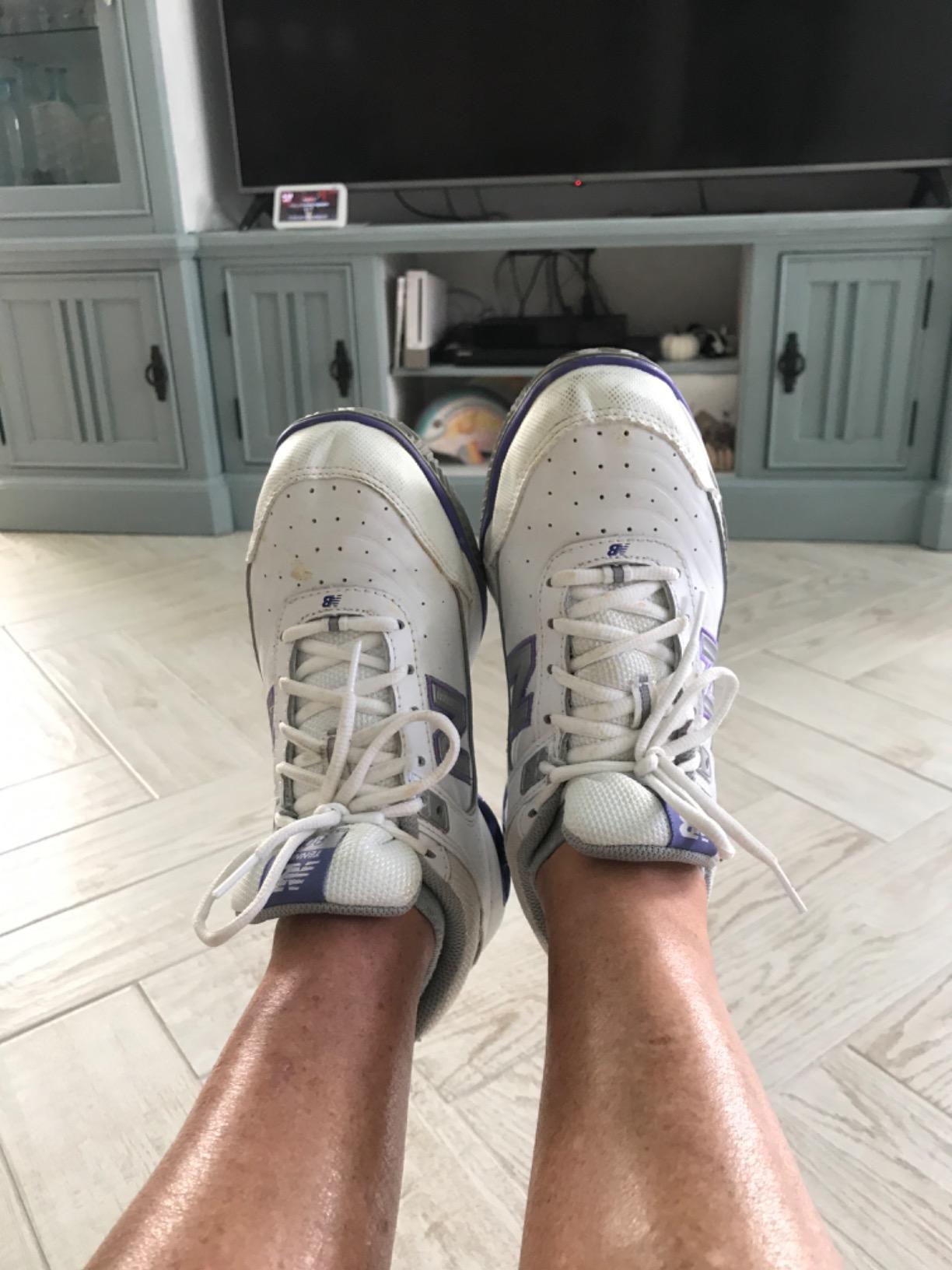 New Balance Women's 806 tennis shoe on court surface showing herringbone traction pattern in action