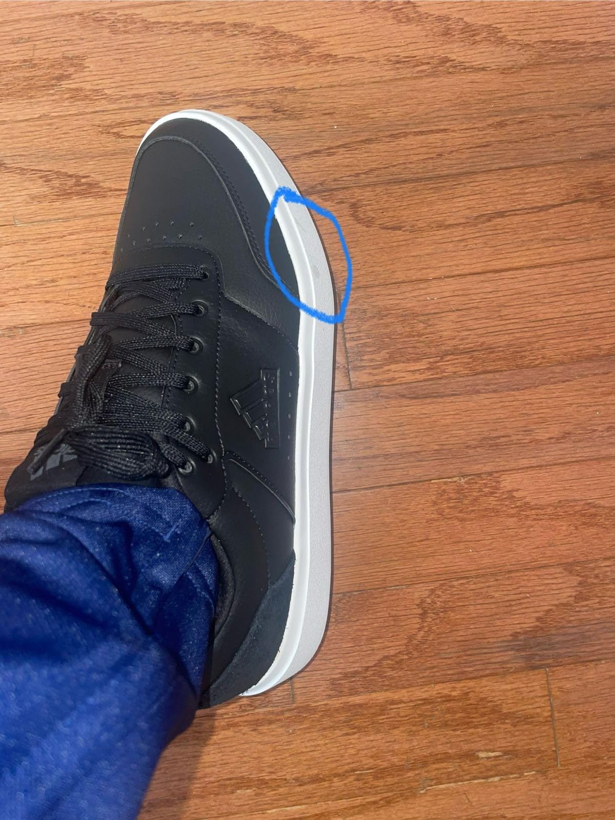 Adidas Men's Park Street white sneakers showing clean minimalist design and classic three stripes