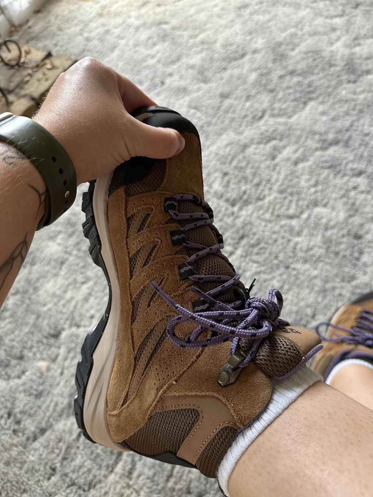 Hiking boot sizing demonstration showing proper thumb space for Columbia Crestwood fit