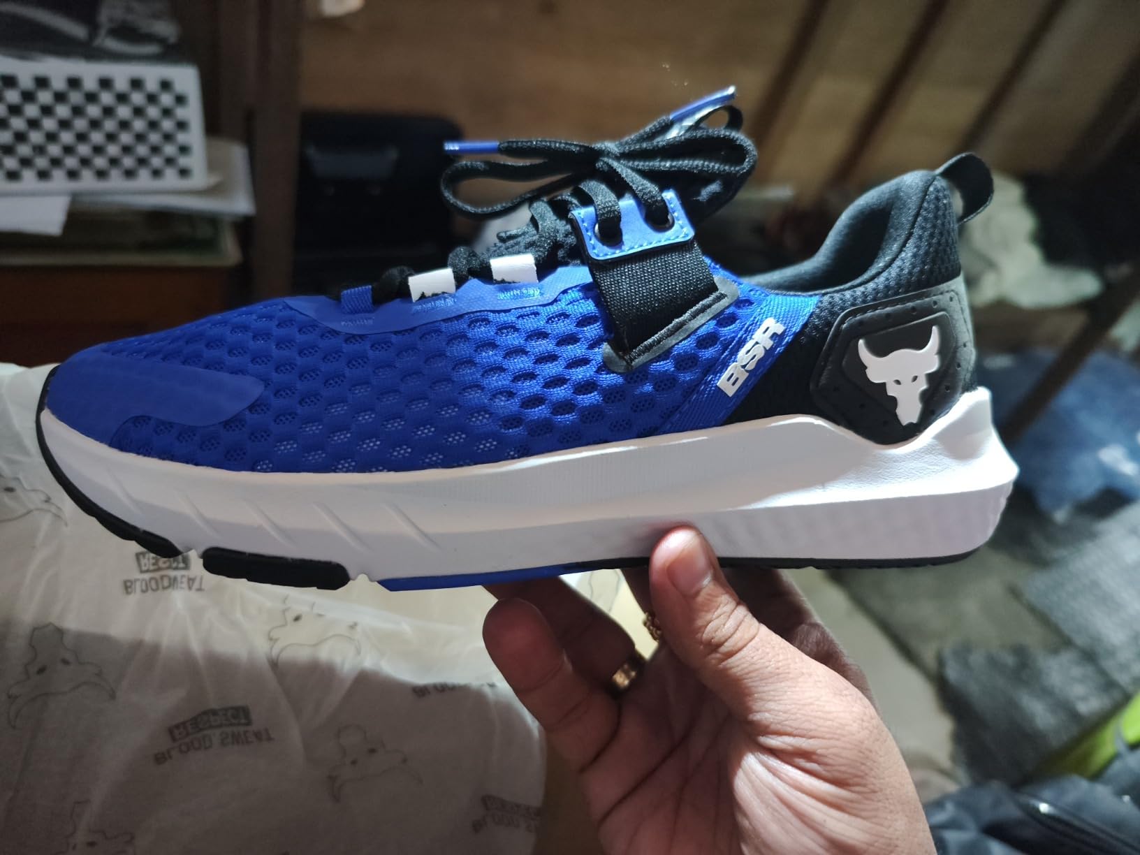 Side profile of Under Armour Project Rock BSR 4 showing bootie design and heel support structure