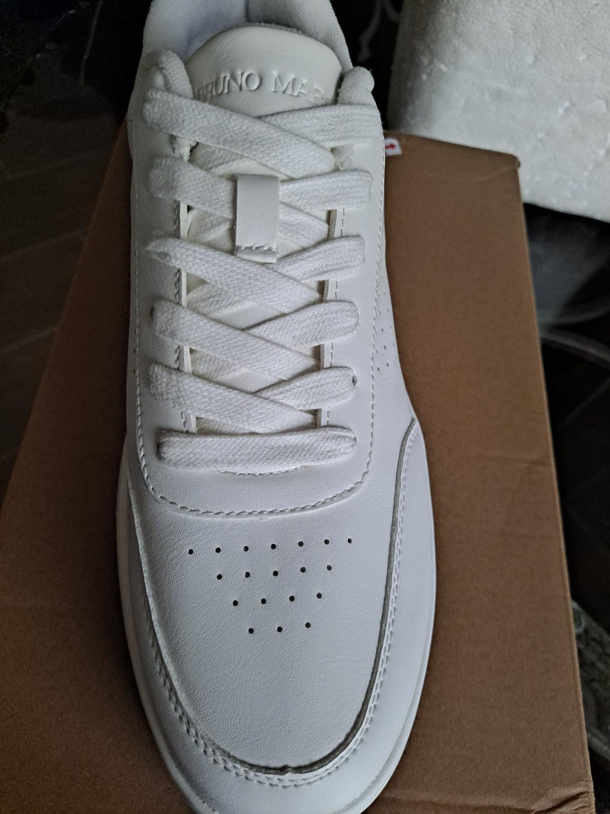 Interior view of Bruno Marc sneaker showing removable EVA arch support insole and padded heel collar construction