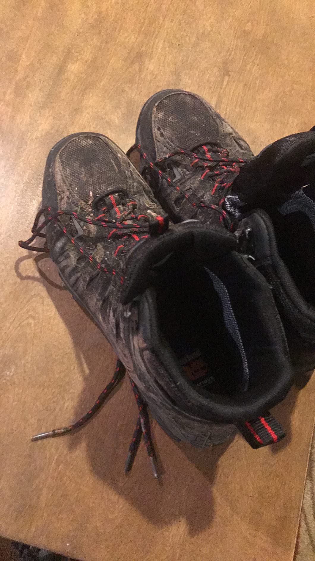 SHULOOK hiking boots during wet weather testing, showing real-world waterproof performance