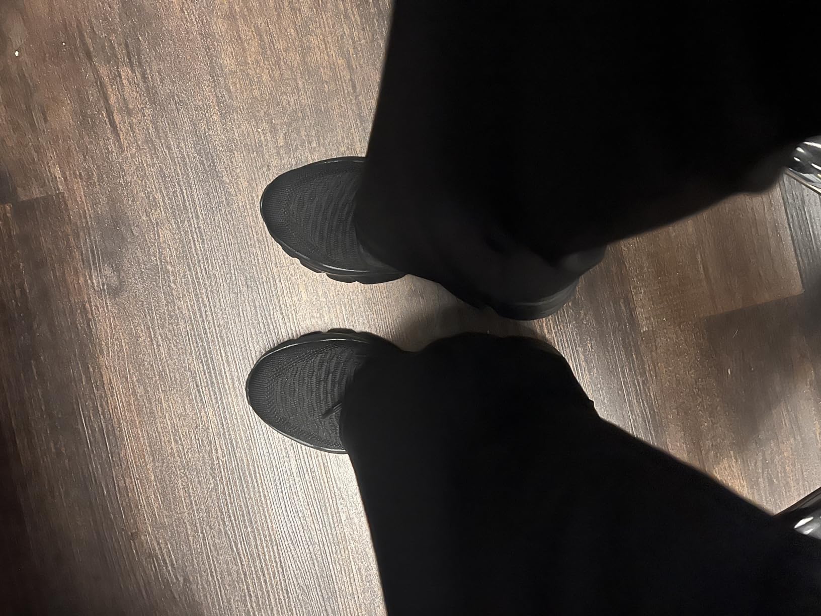 Lifestyle shot of KEEZMZ Women's Slip-On Athletic Sneakers worn during daily activities outdoors