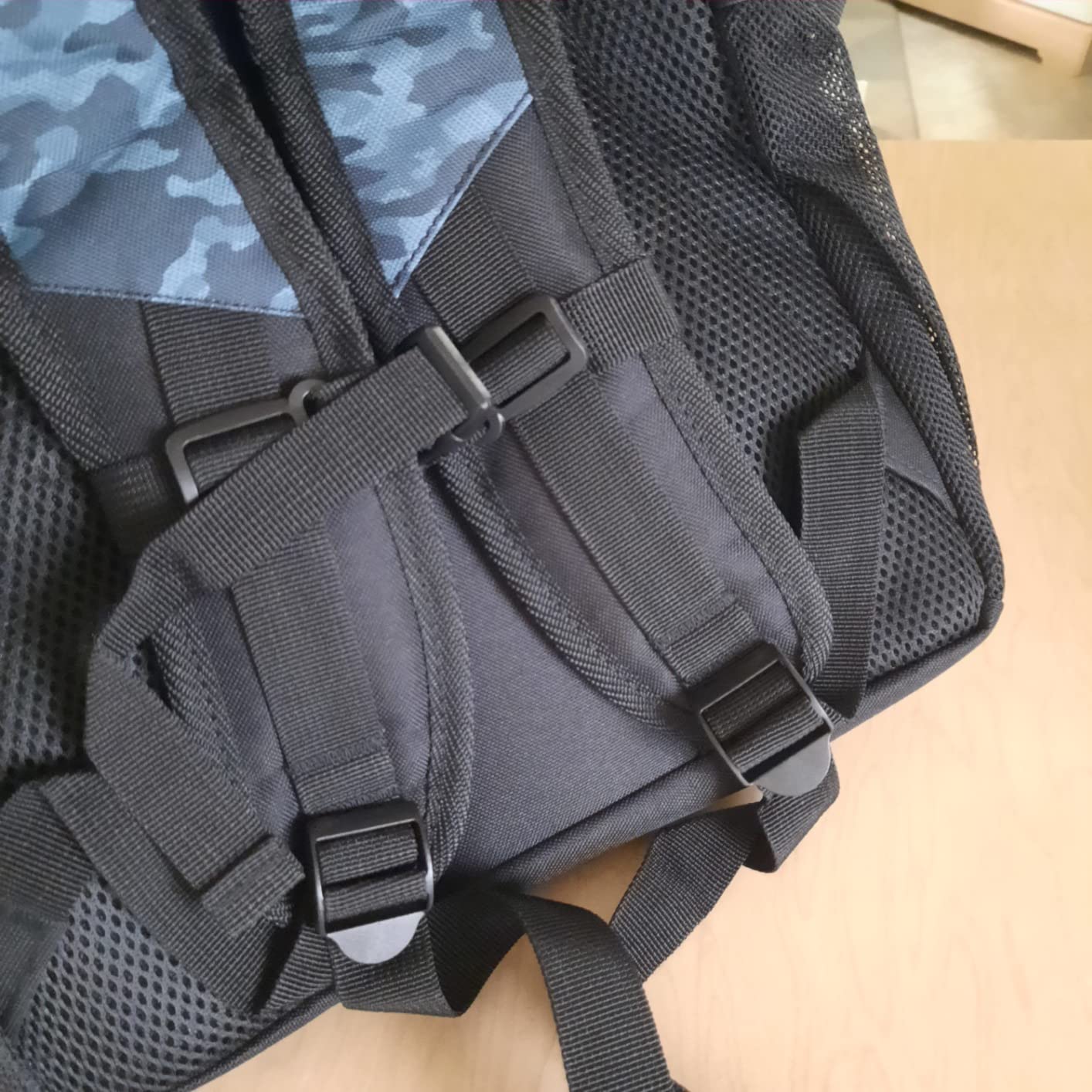 WOLT Basketball Backpack interior organization showing main compartment pockets, laptop sleeve, and inner pocket layout