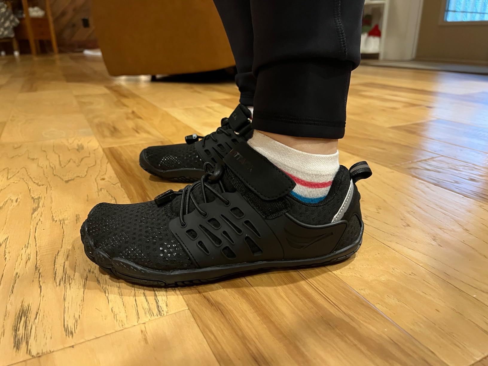 Grand Attack barefoot shoes showing flexible construction and velcro strap closure system