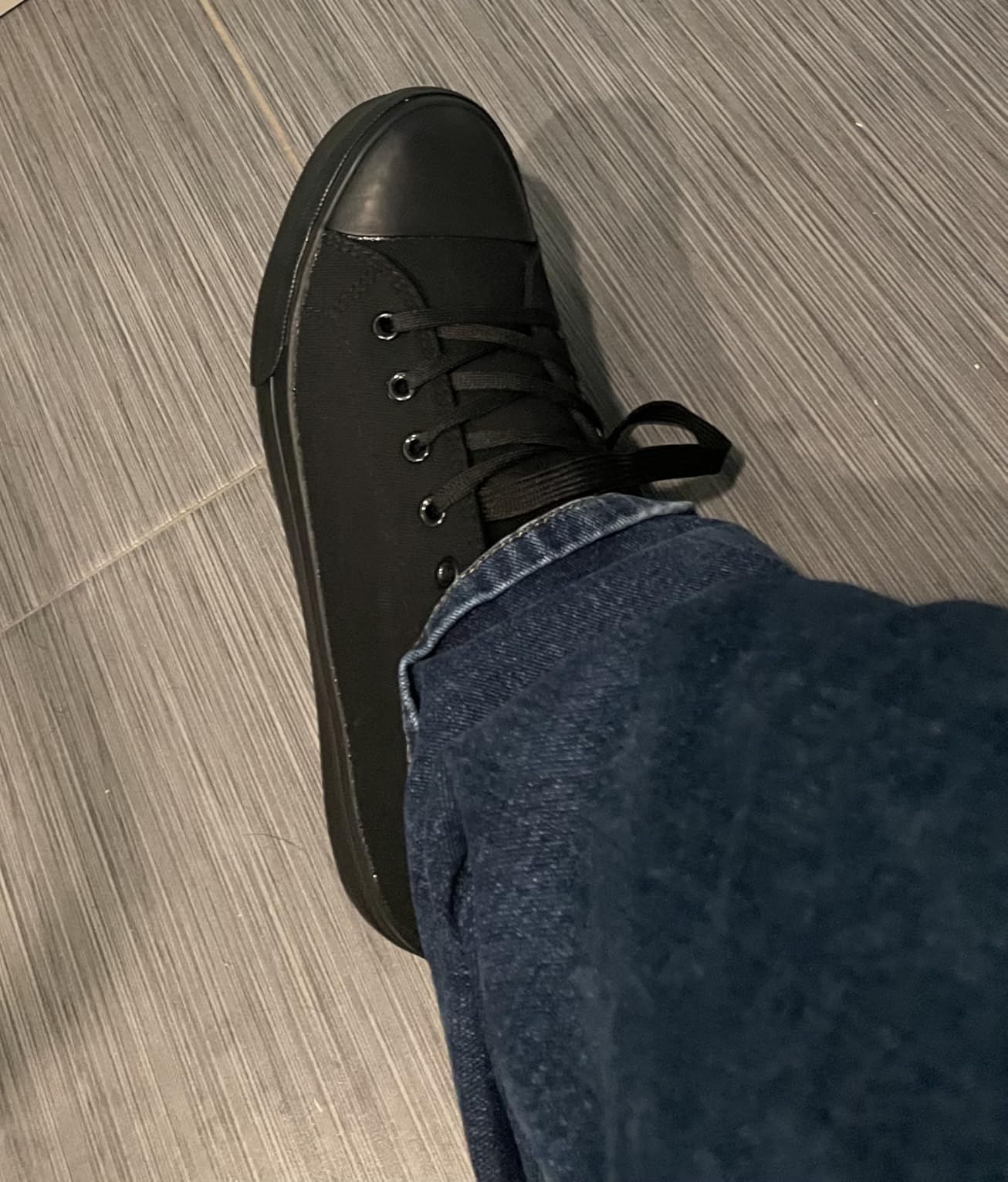 Close-up of ZGR canvas shoes showing lacing system, metal eyelets, and padded collar detail