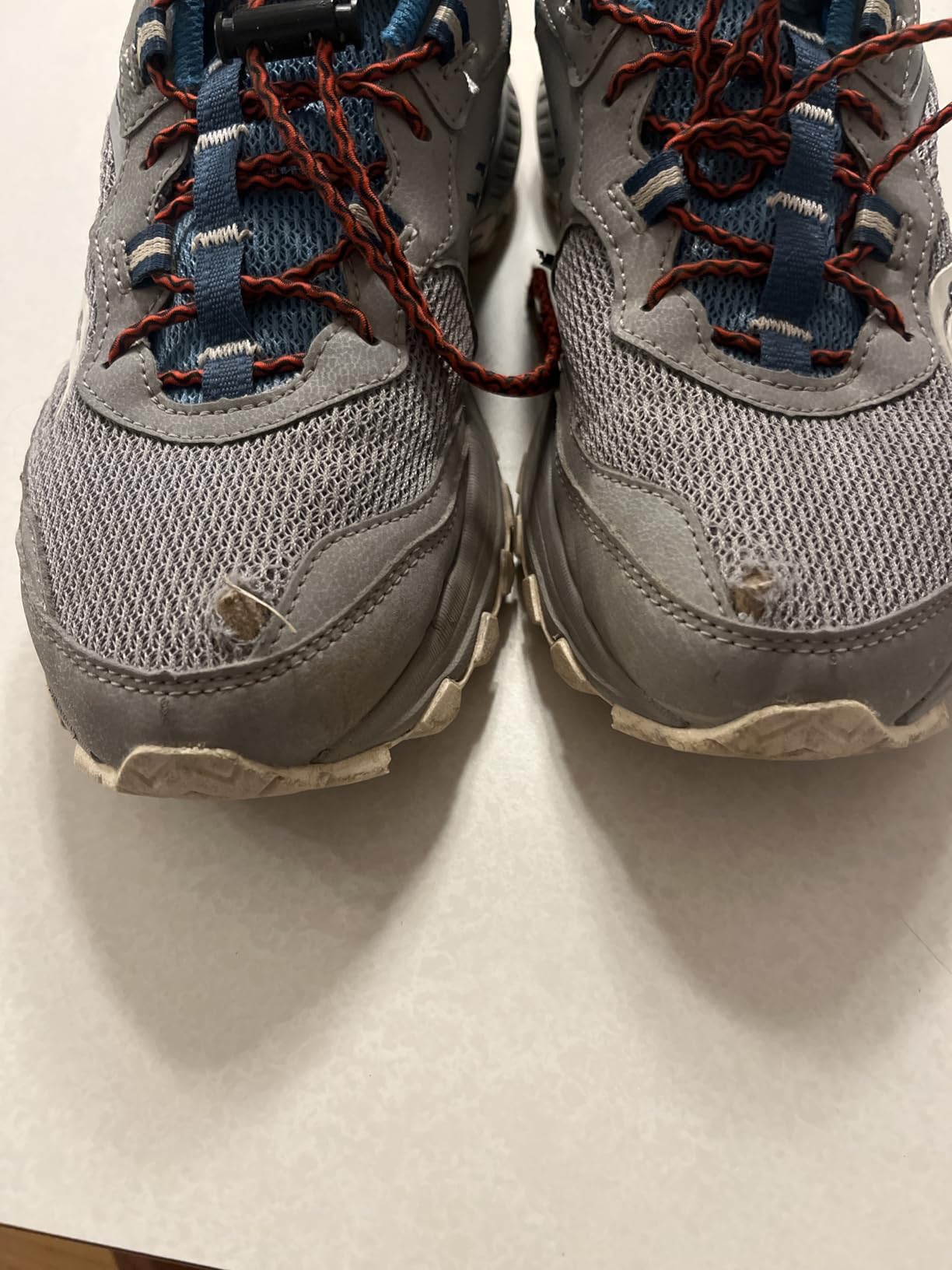 Close-up of Saucony Excursion TR15 mesh upper showing protective overlays and lace-up closure system