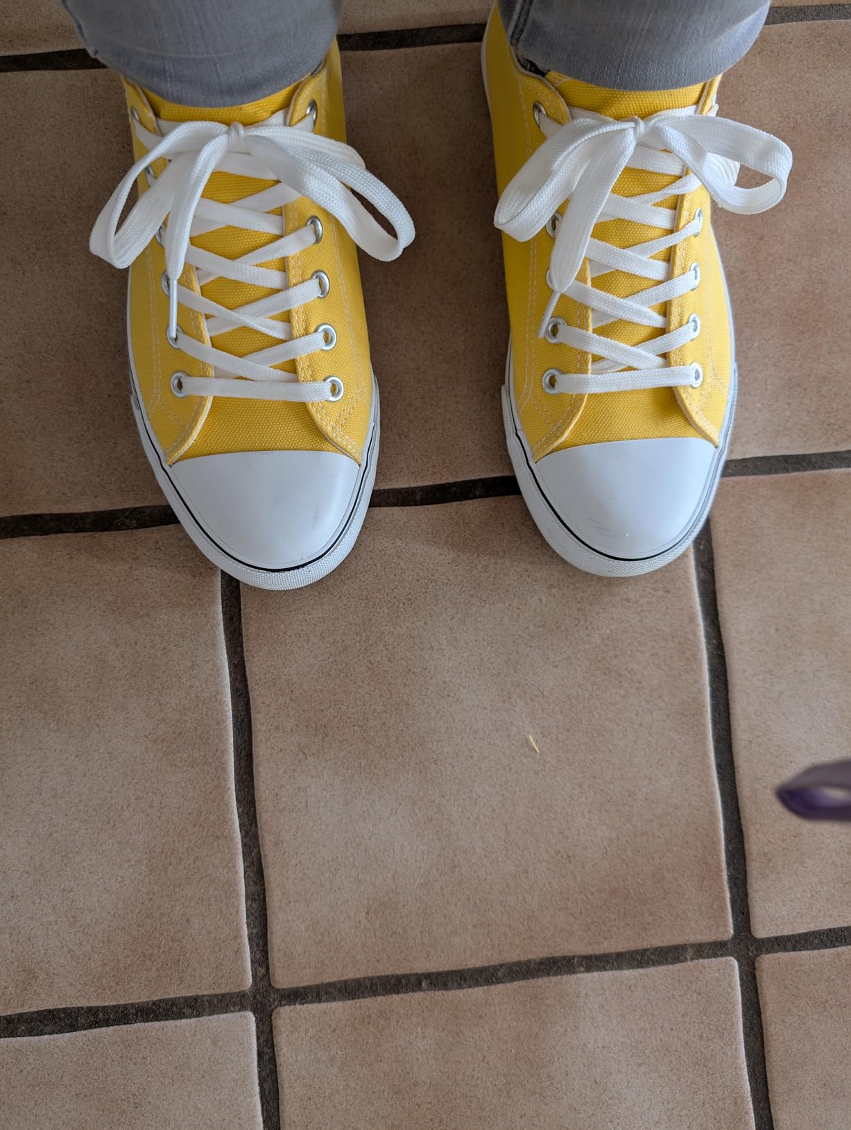 FRACORA canvas sneakers worn during everyday activities — casual street-style setting